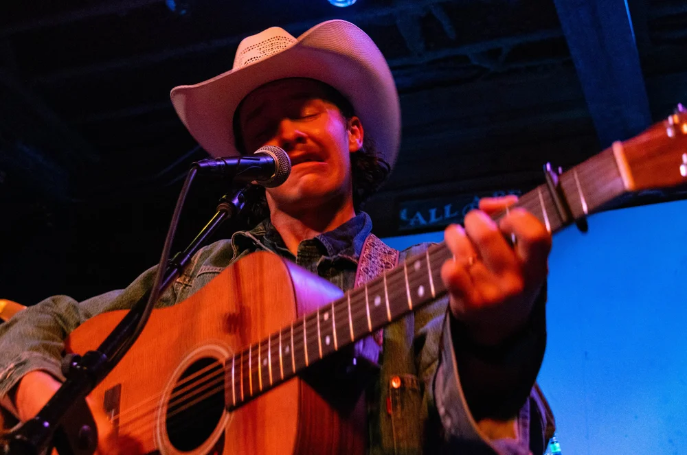  Blocker sings the lyrics, “Now, won't you batter down by Baton Rouge? River Queen, roll it on,” during “Big River.” 