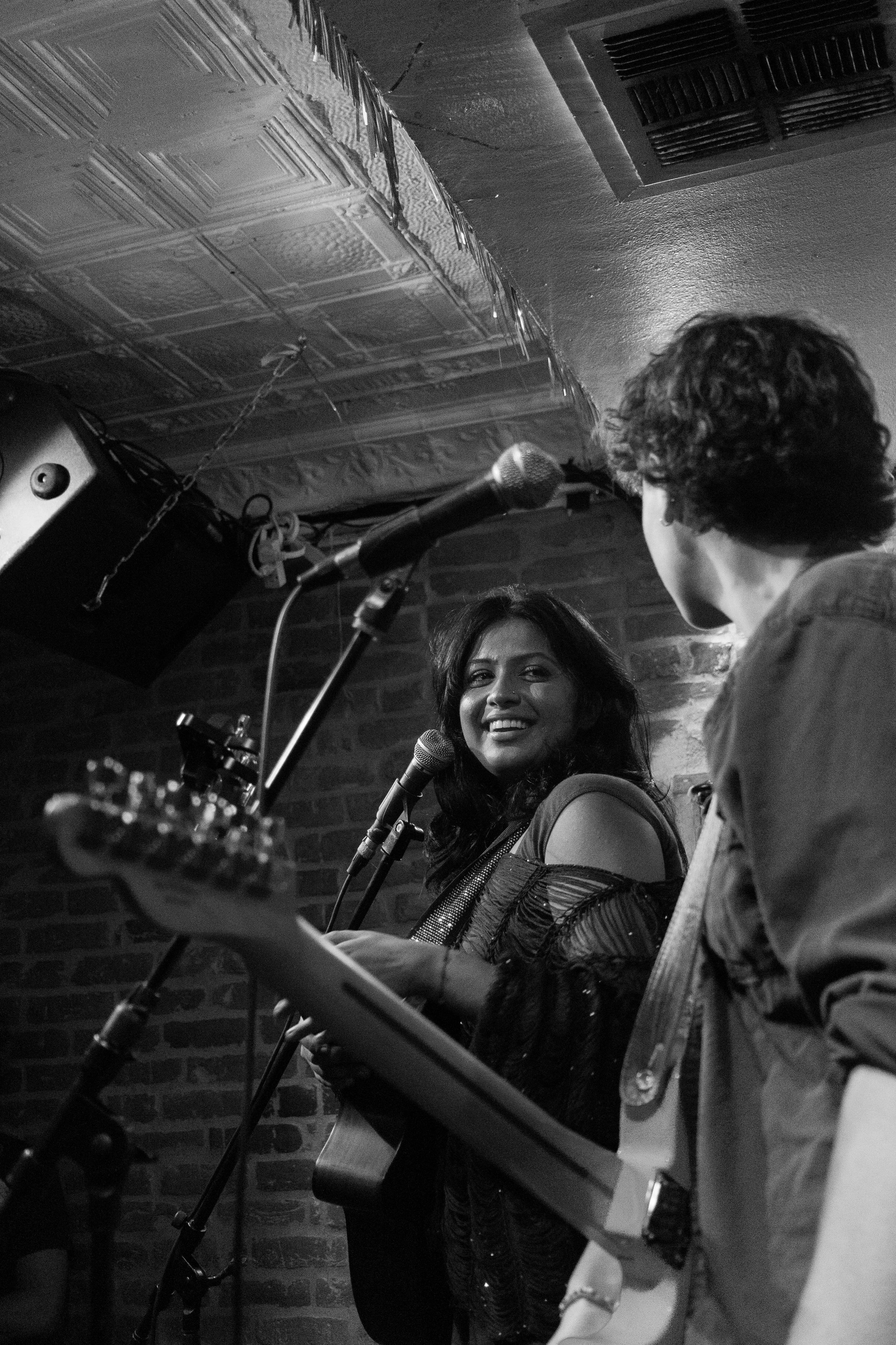  In between songs, Sriyam and her guitarist, AB Brown, tell the audience jokes.  Photo by Ellis Jarvis  