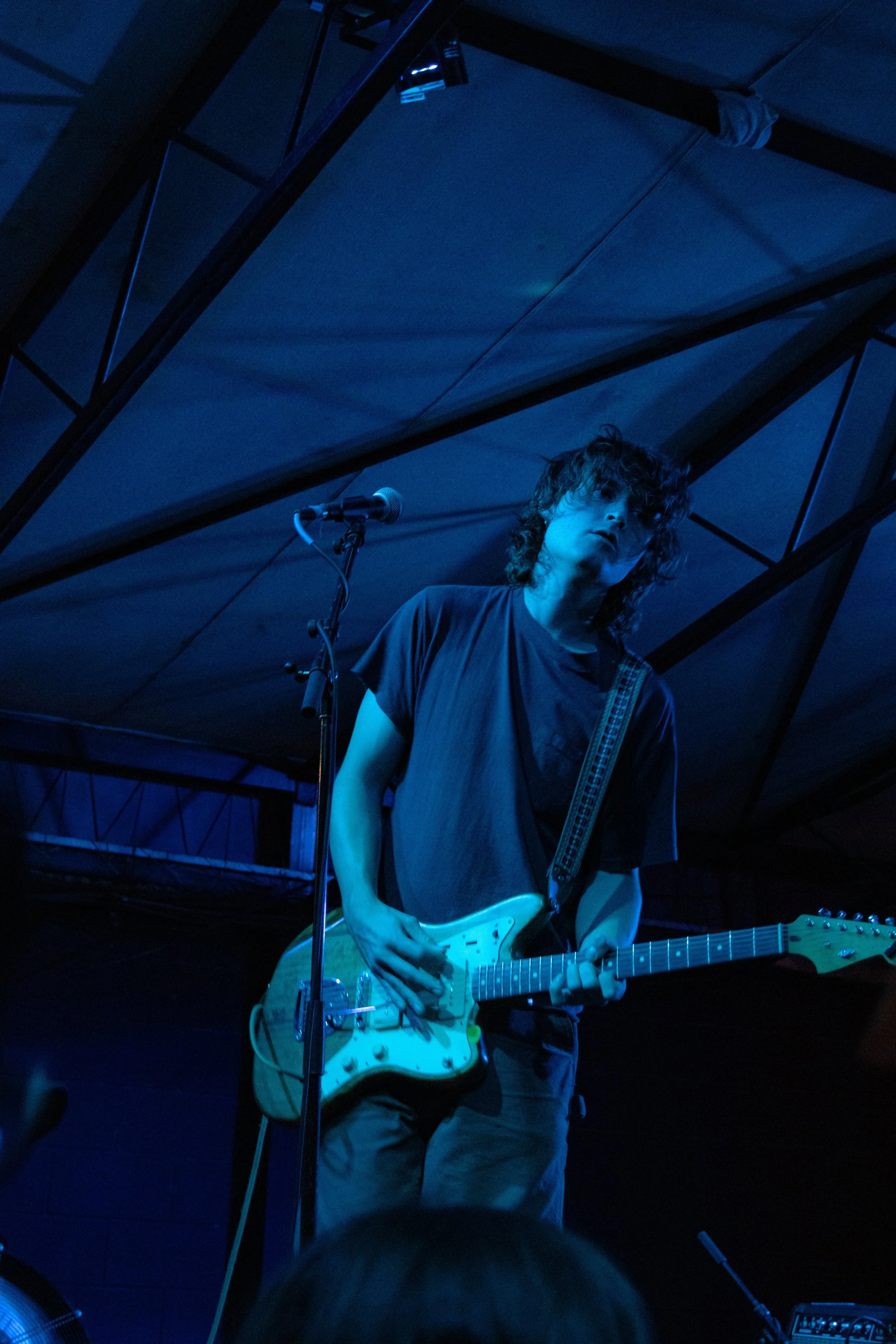  Guitarist Liam Armstrong plays a distorted guitar melody in “Little Birds.” 