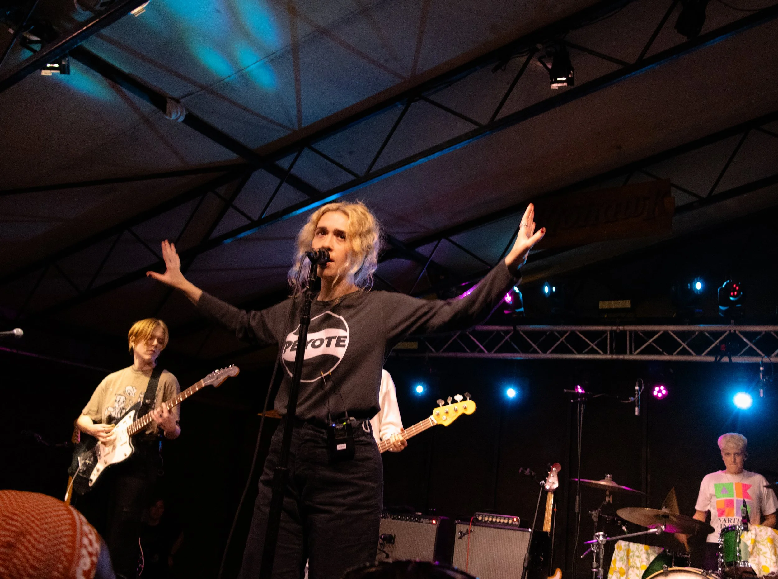  Blondshell sticks her arms out while singing the reflective track, “23’s a Baby.” 