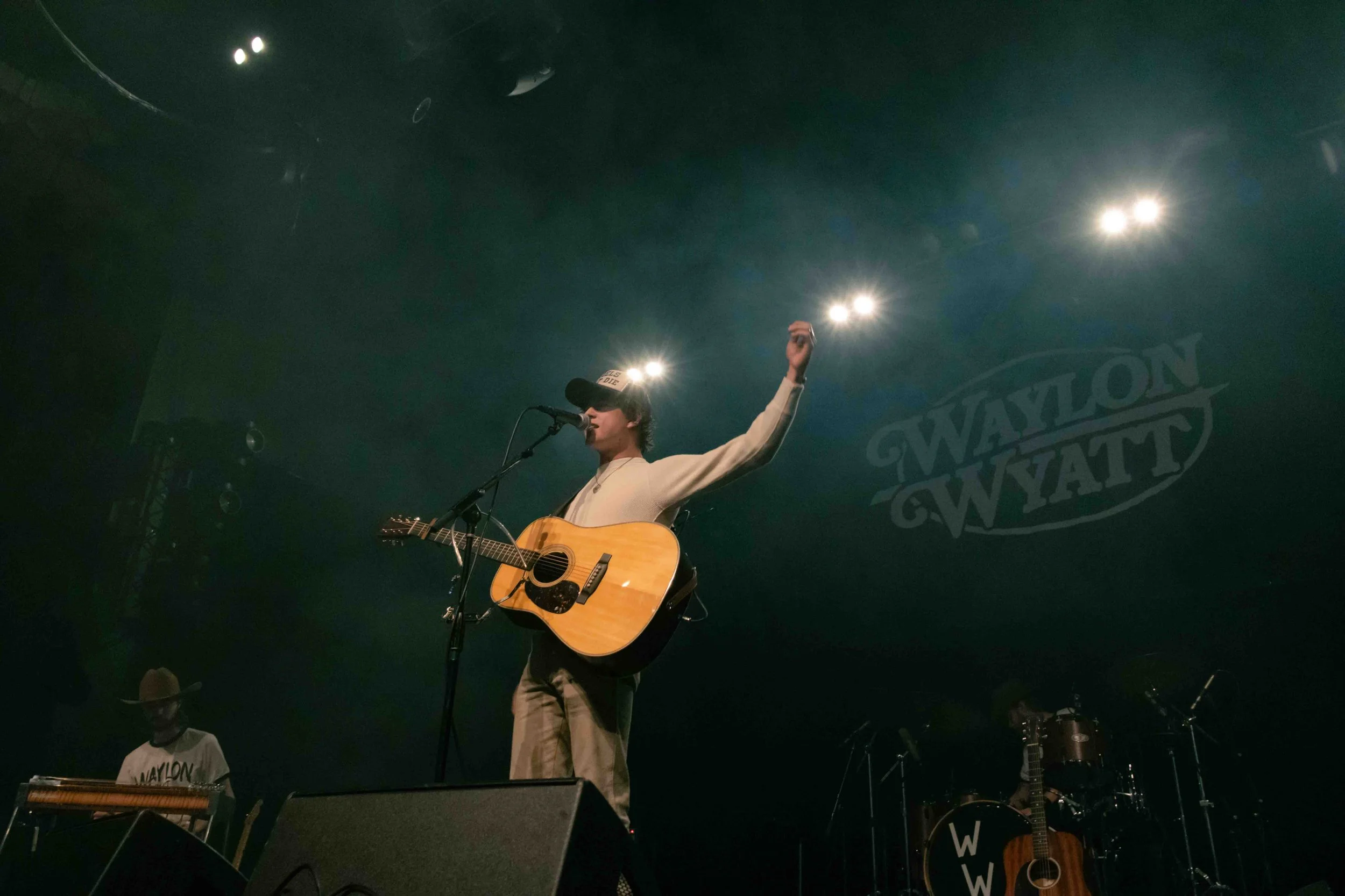  Wyatt raises his arm while asking the crowd if they are excited for the show. 
