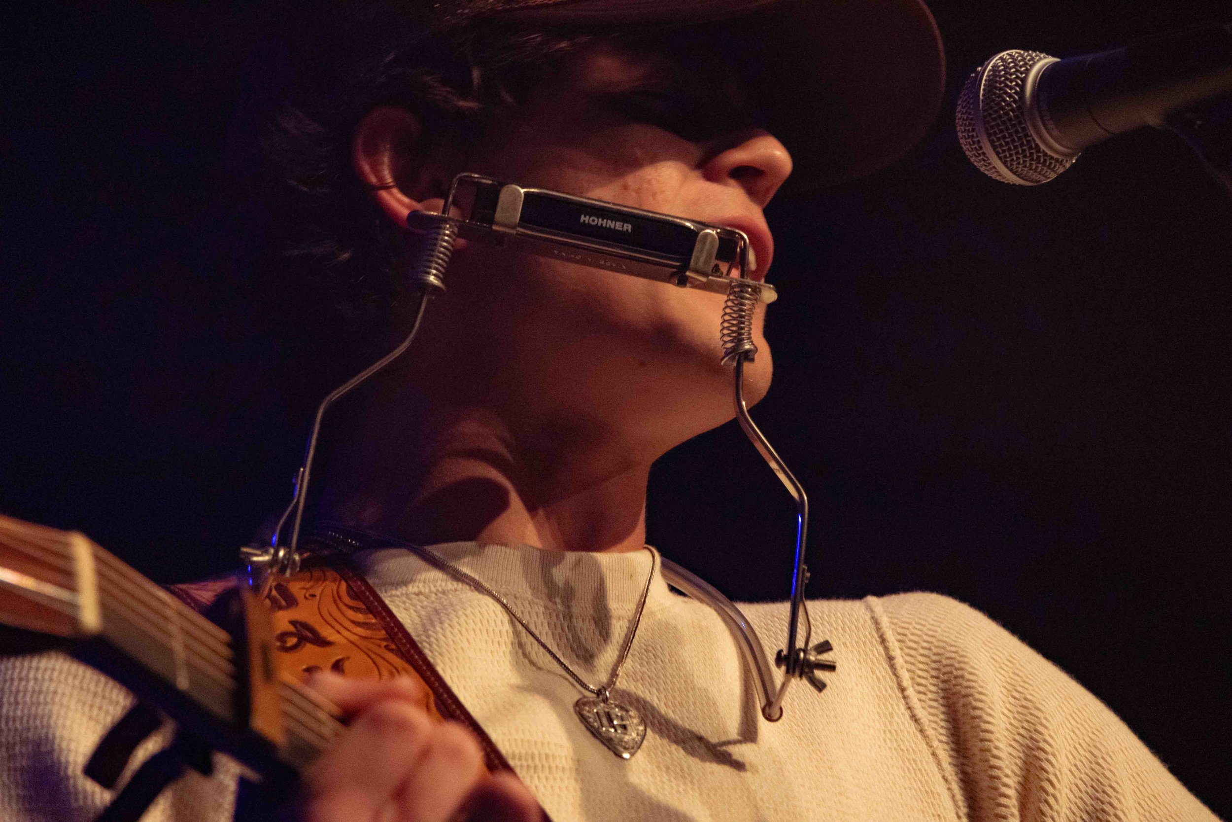  Wyatt performs the slow “Pretty Little Liar” with his harmonica supported by a neckpiece. 