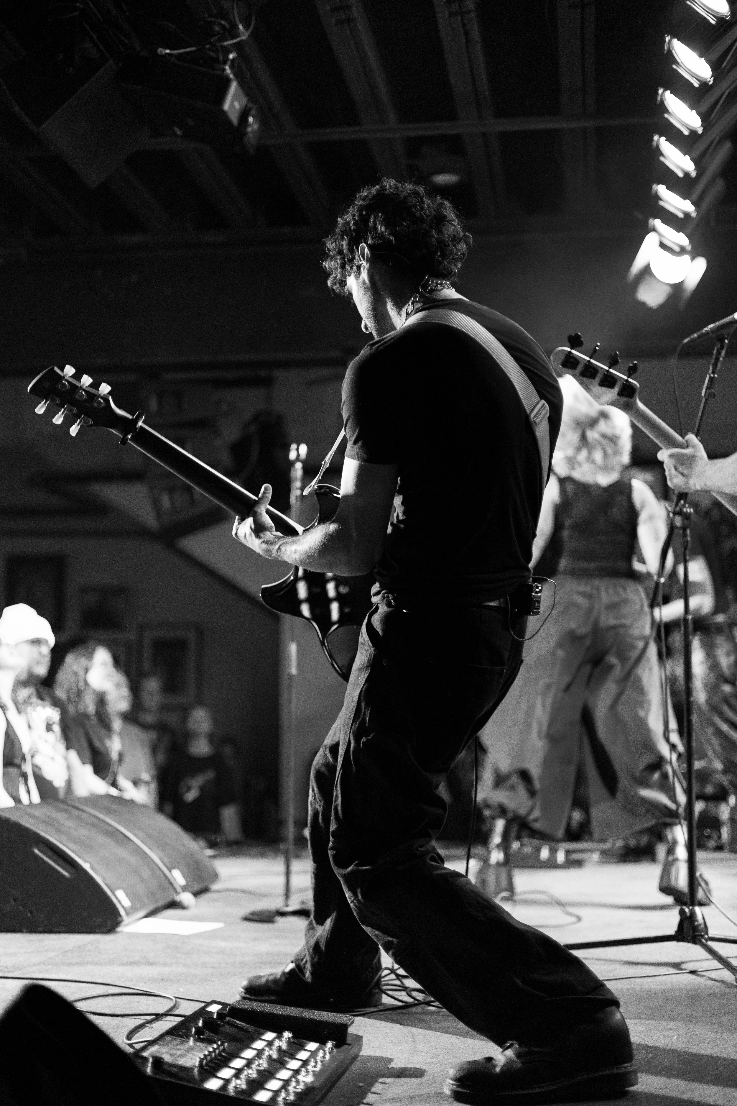  Guitarist Aaron Liebman focuses on playing his riff during the band’s performance of its latest single, “bad seed.” 