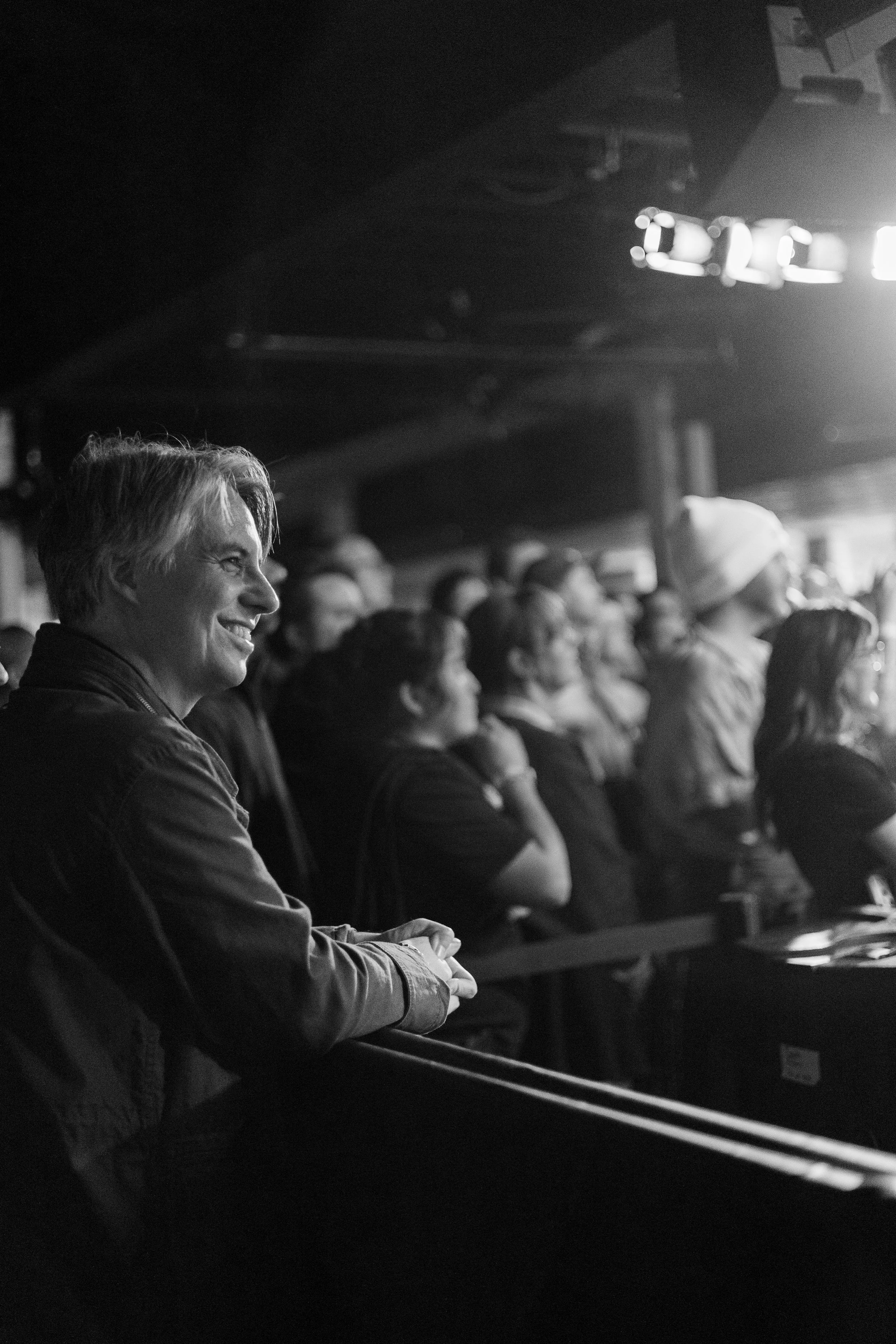  Fans smile as they watch Acorn perform her new album during her North American tour. 