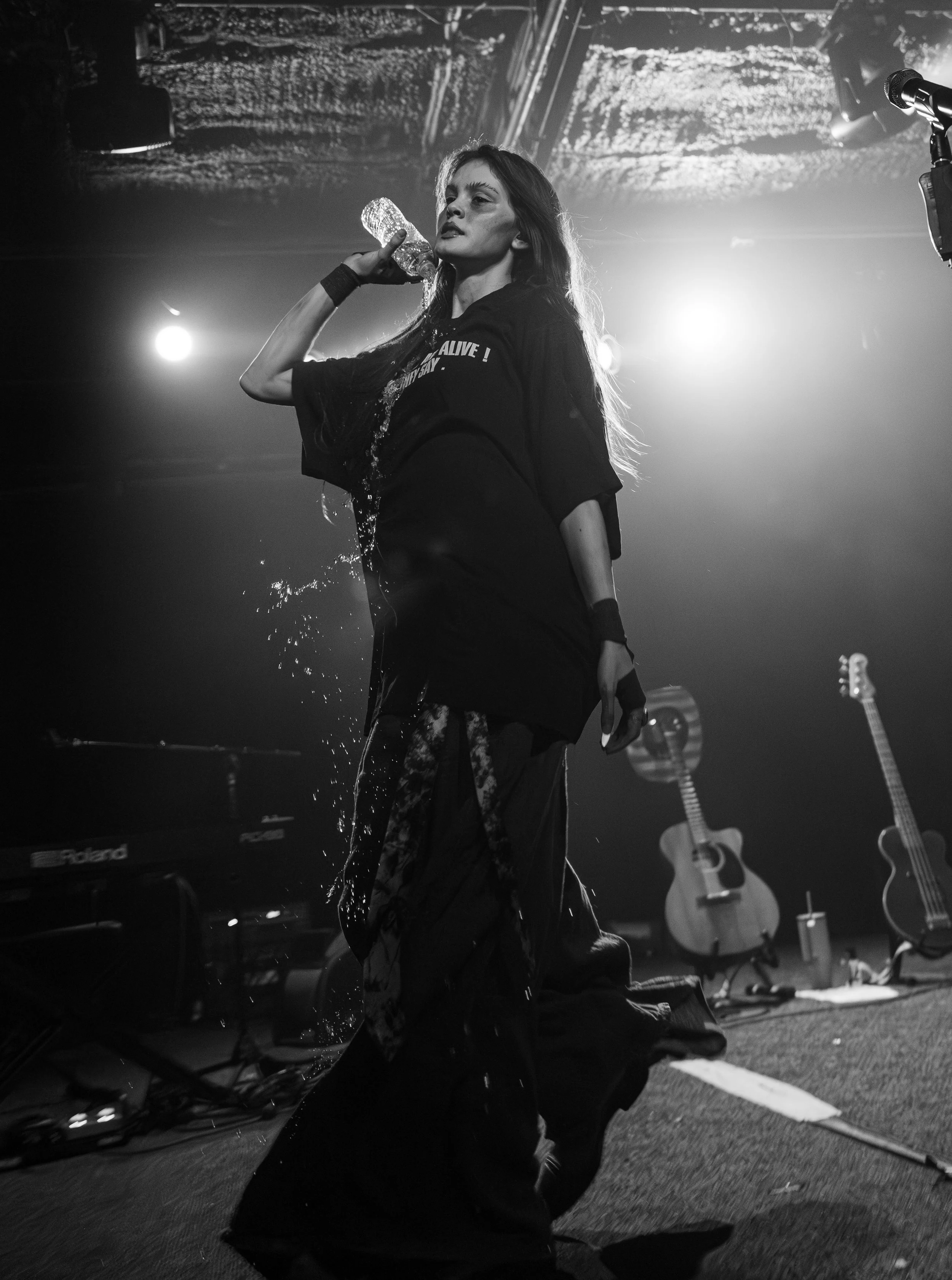  Sofia Isella pours out a water bottle as she runs onto the stage to perform her latest single, “Out in the Garden.” 