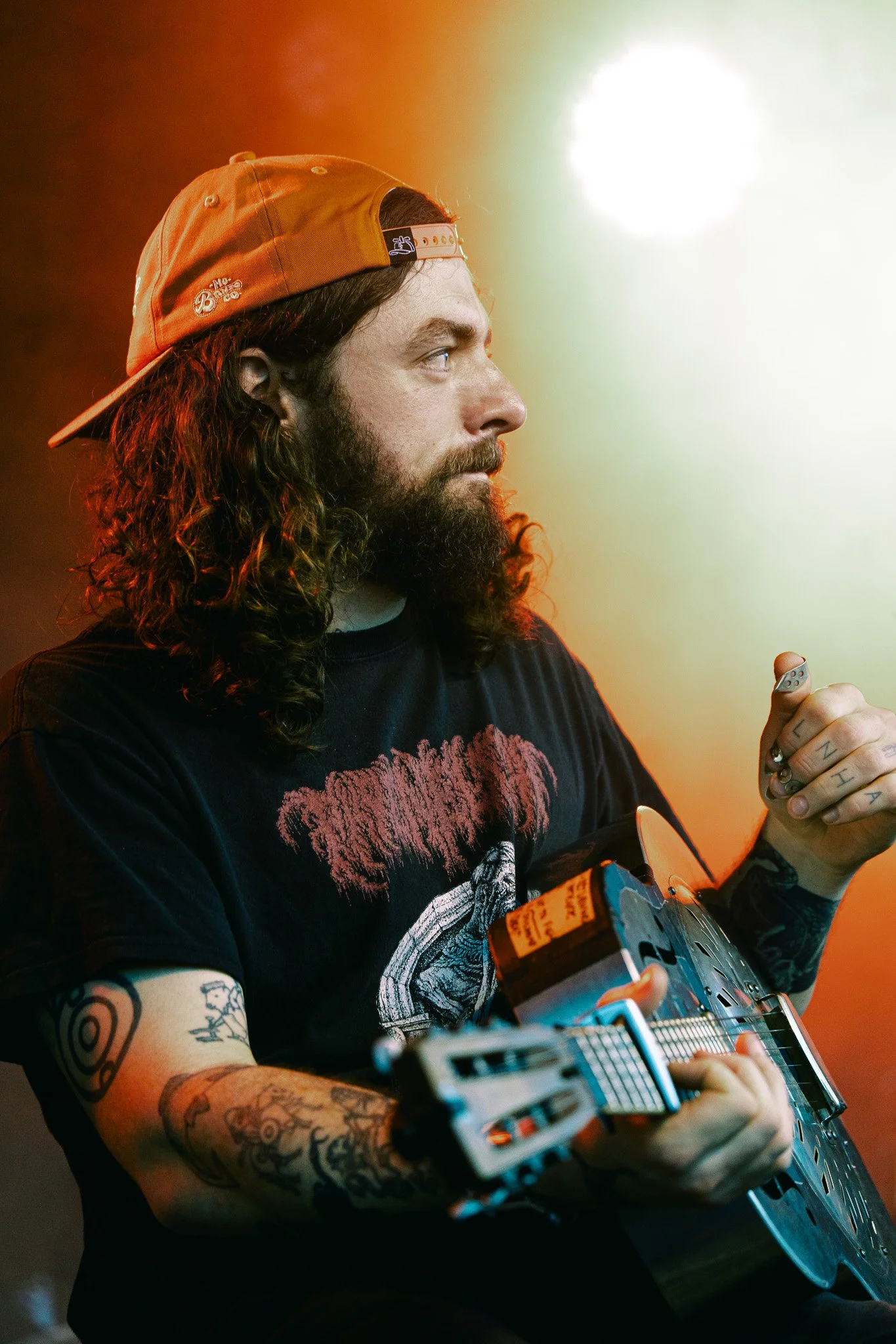  Songwriter, musician, and half of DUG, Conor O’Reilly strums a metallic guitar during the long instrumental opening to “Big Sundown.” 