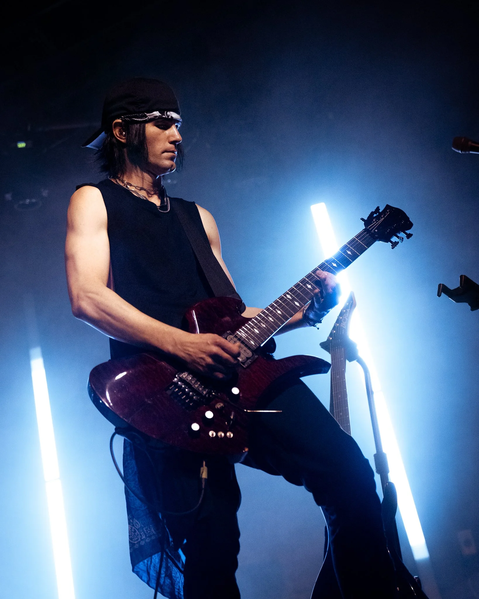  During “fang,” Timmy Vopatplays his guitar intently. 