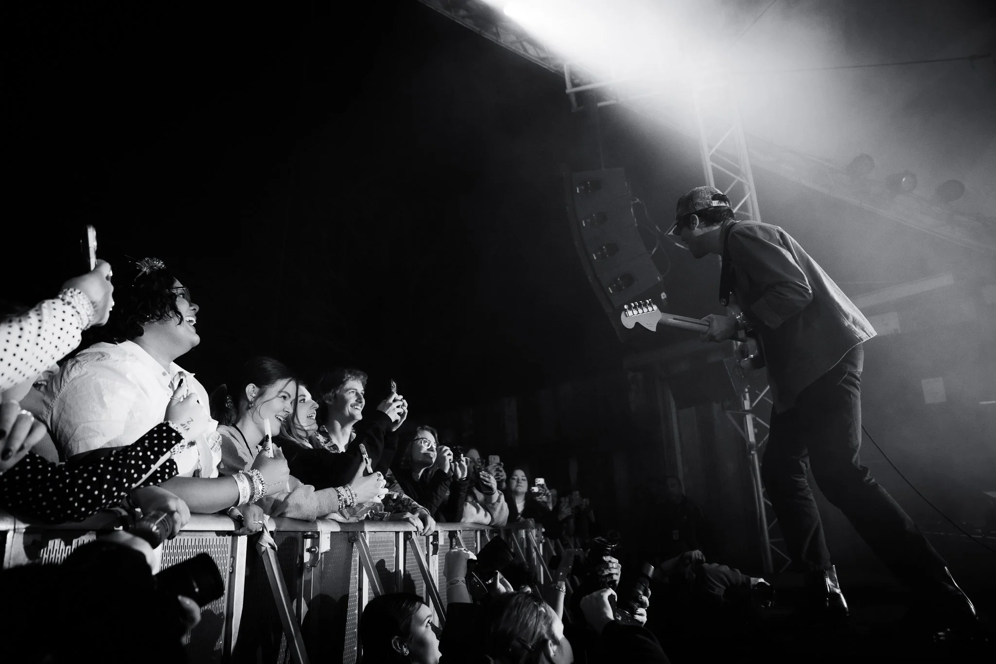  During “Better Than I Know Myself,” Jaffe stands on a speaker and smiles at the crowd. 