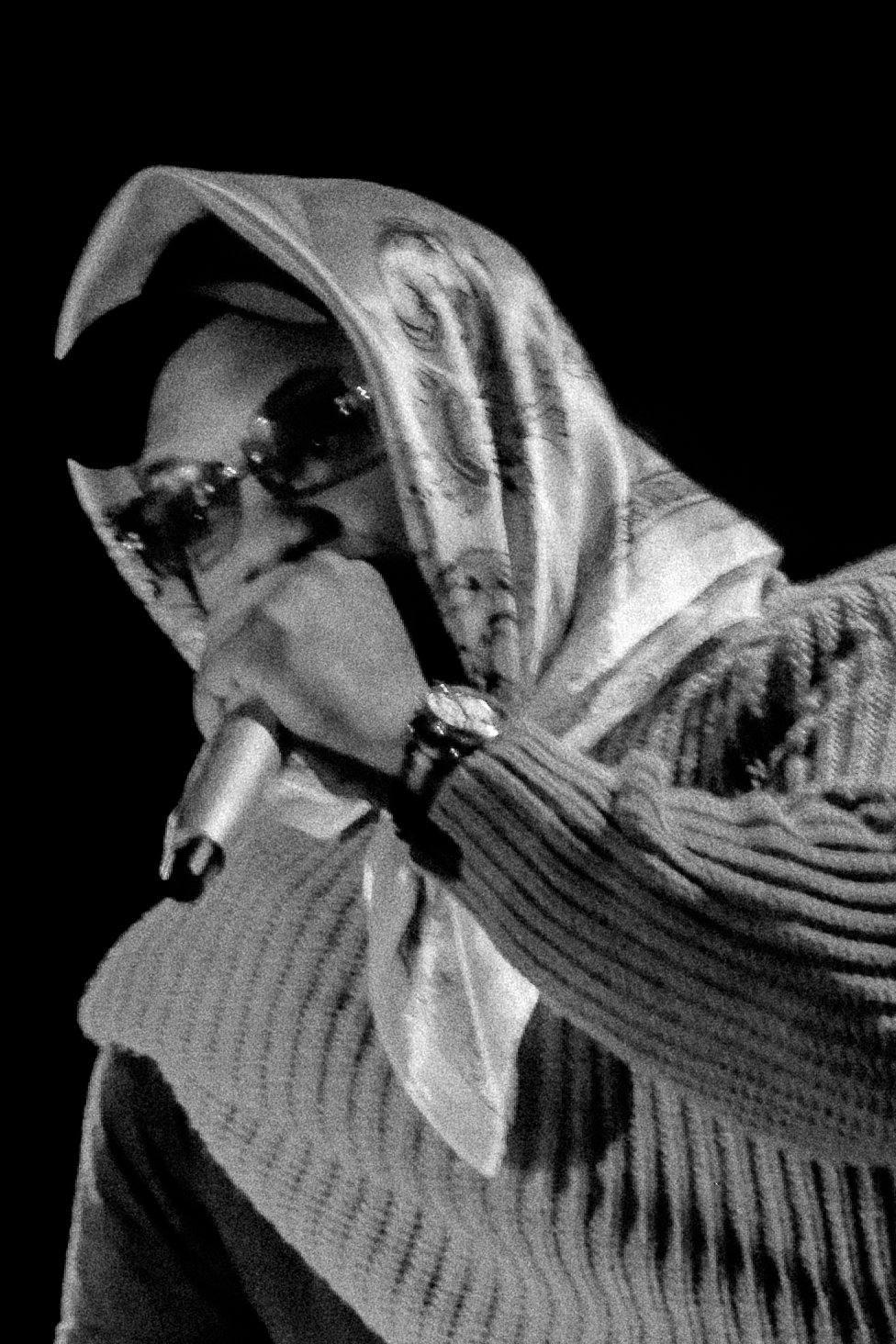  Los Angeles artist Asha Imuno holds the mic as he opens for Jordan Ward. The crowd laughs as Imuno tells stories of old romantic encounters. 