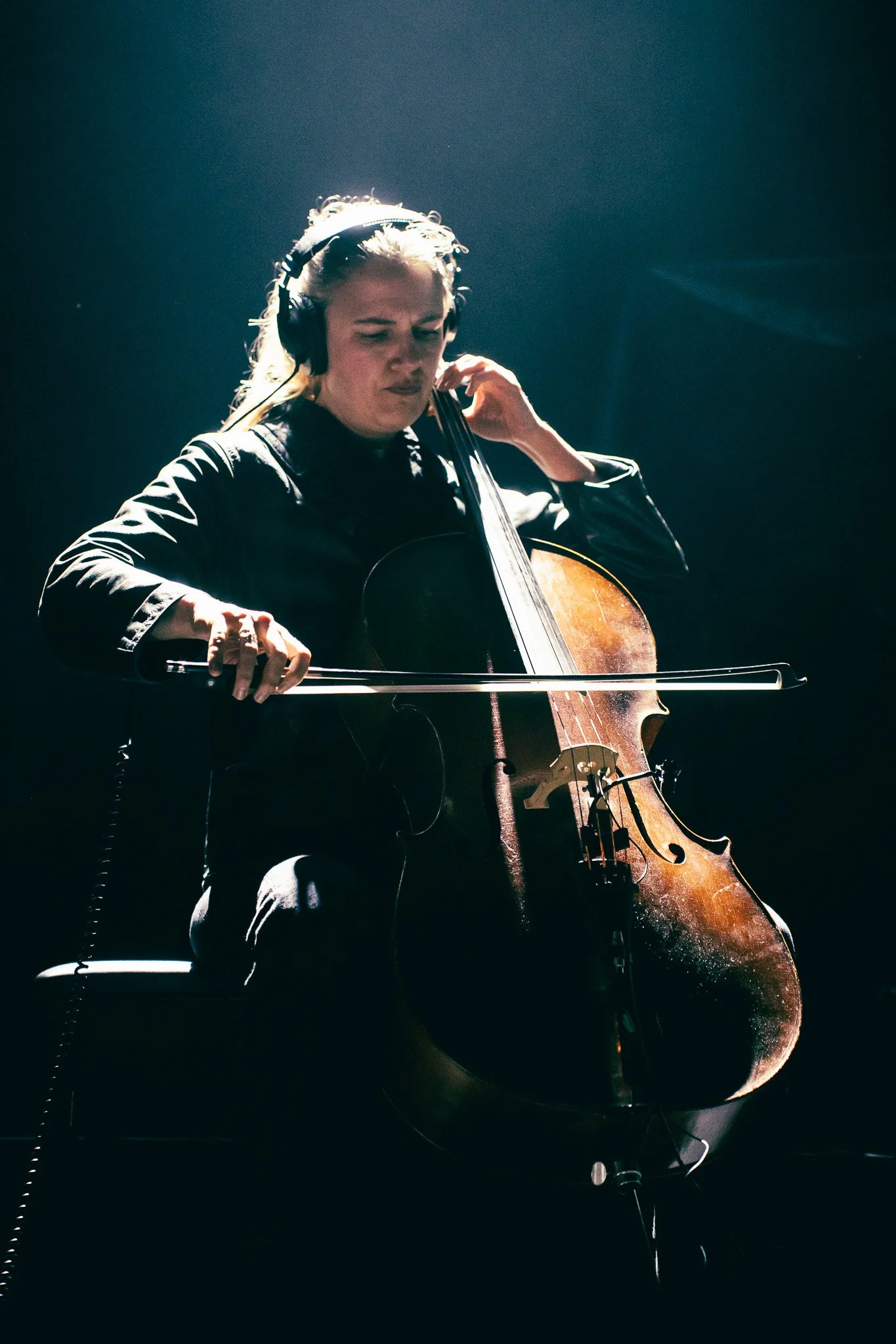  Denmark-based instrumental band, TLF Trio, performs “Dancer” under spotlights. 