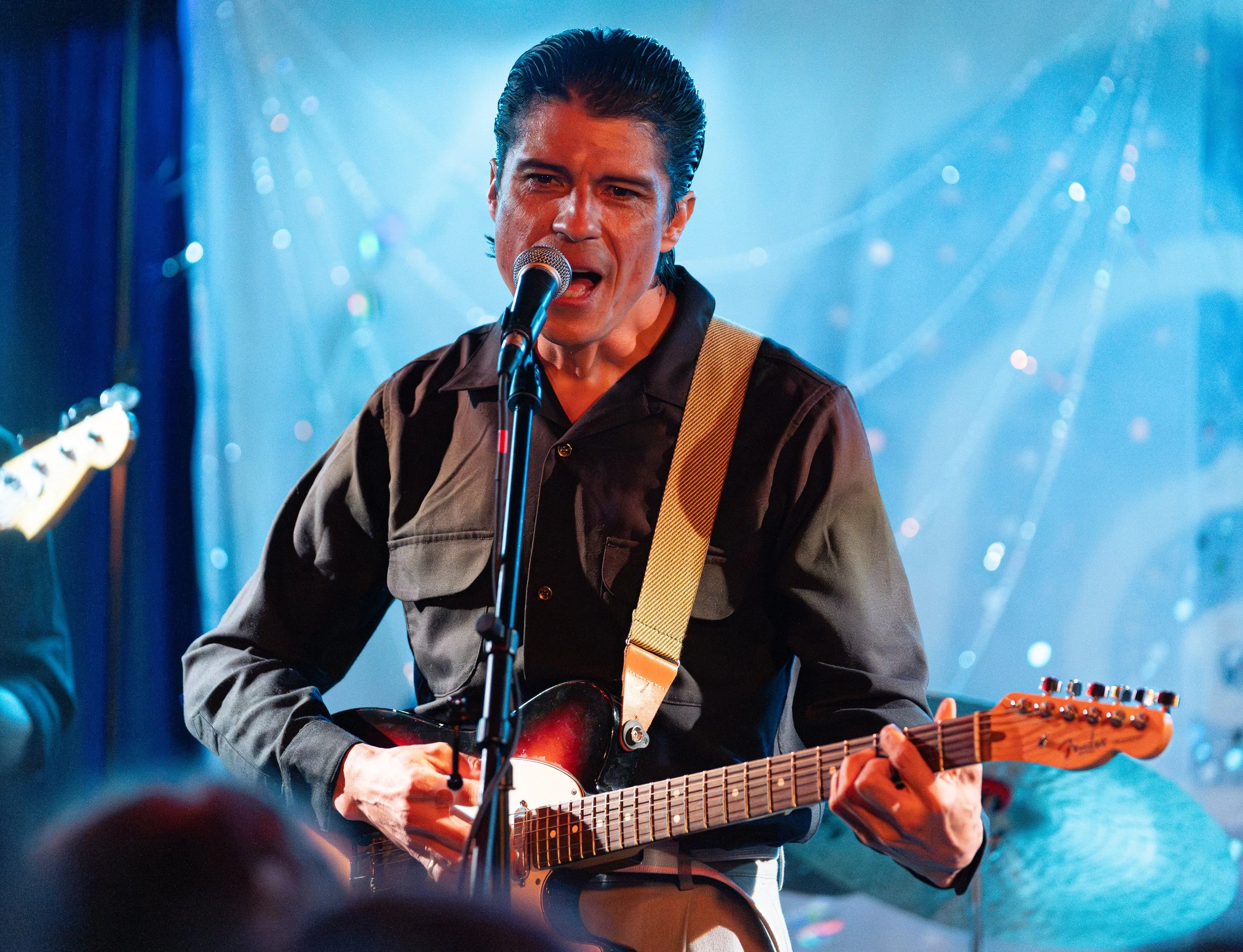  Los Angeles-based artistReverend Baron takes the stage to sing the soothing melodies of “I See You Runnin’” from his 2022 album  From Anywhere.  