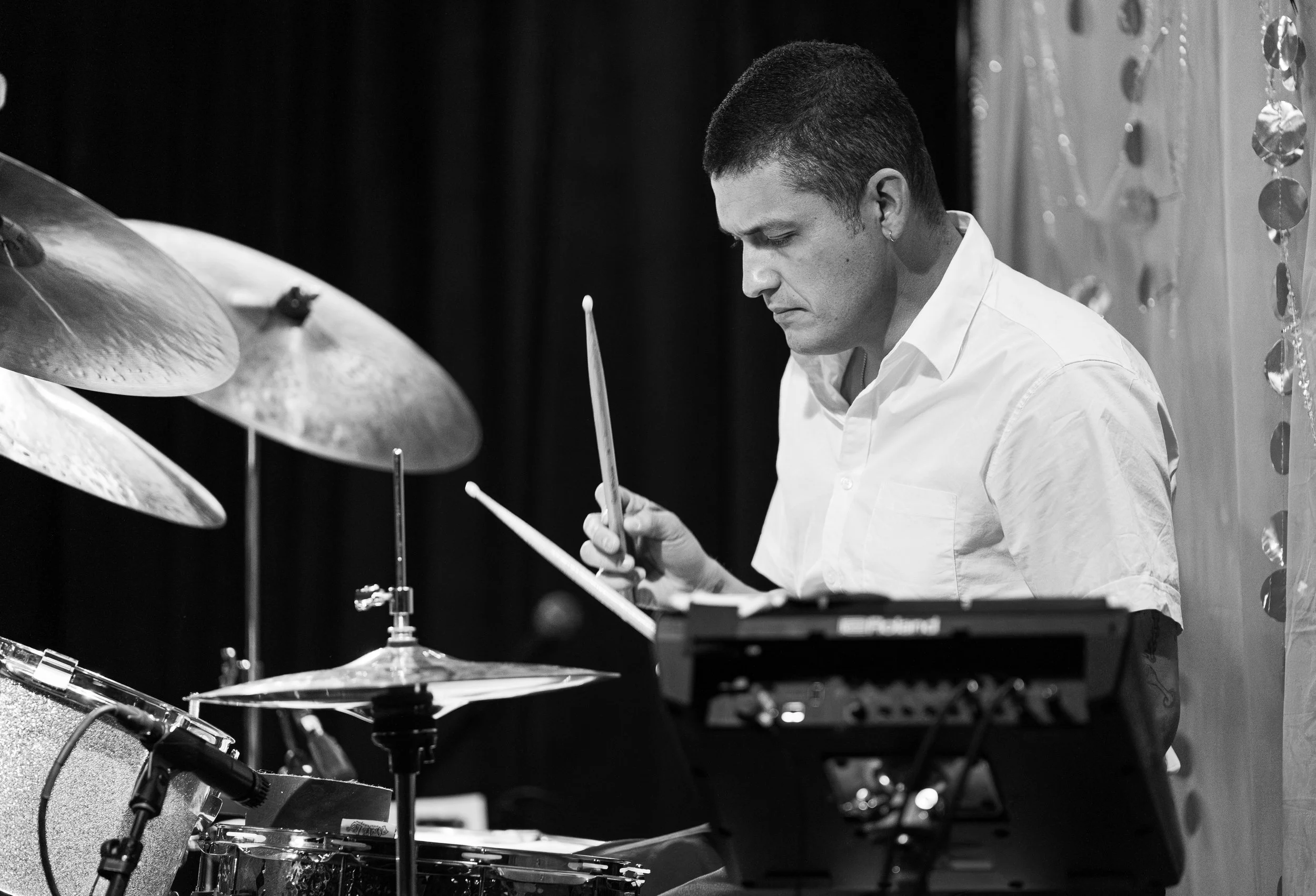  Valdez III bangs the drums to keep the band on beat during “Let the Radio Play.” 