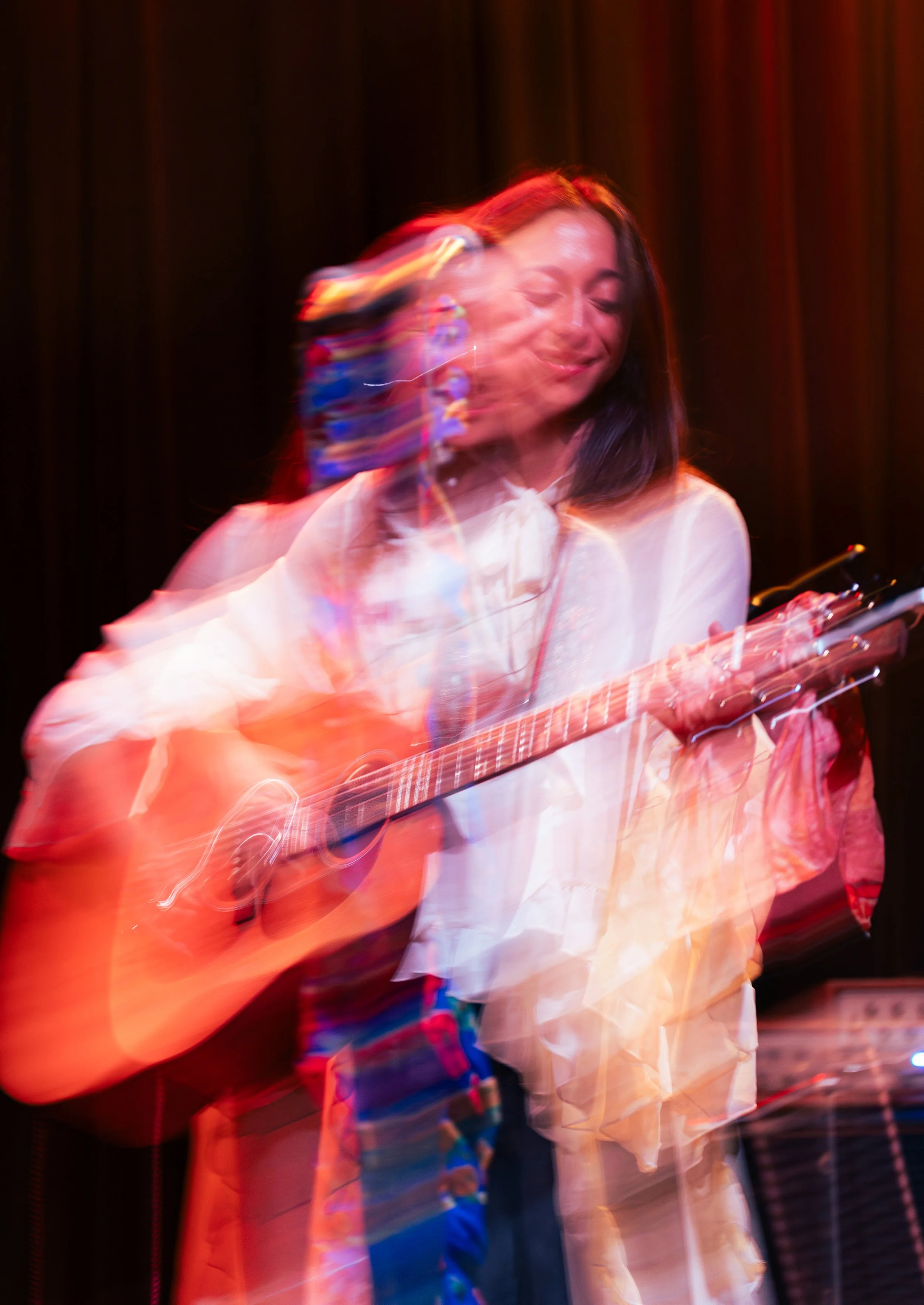  Kohanna strums the guitar during the bridge of “Card Games” from her 2021 album  Hometown.  