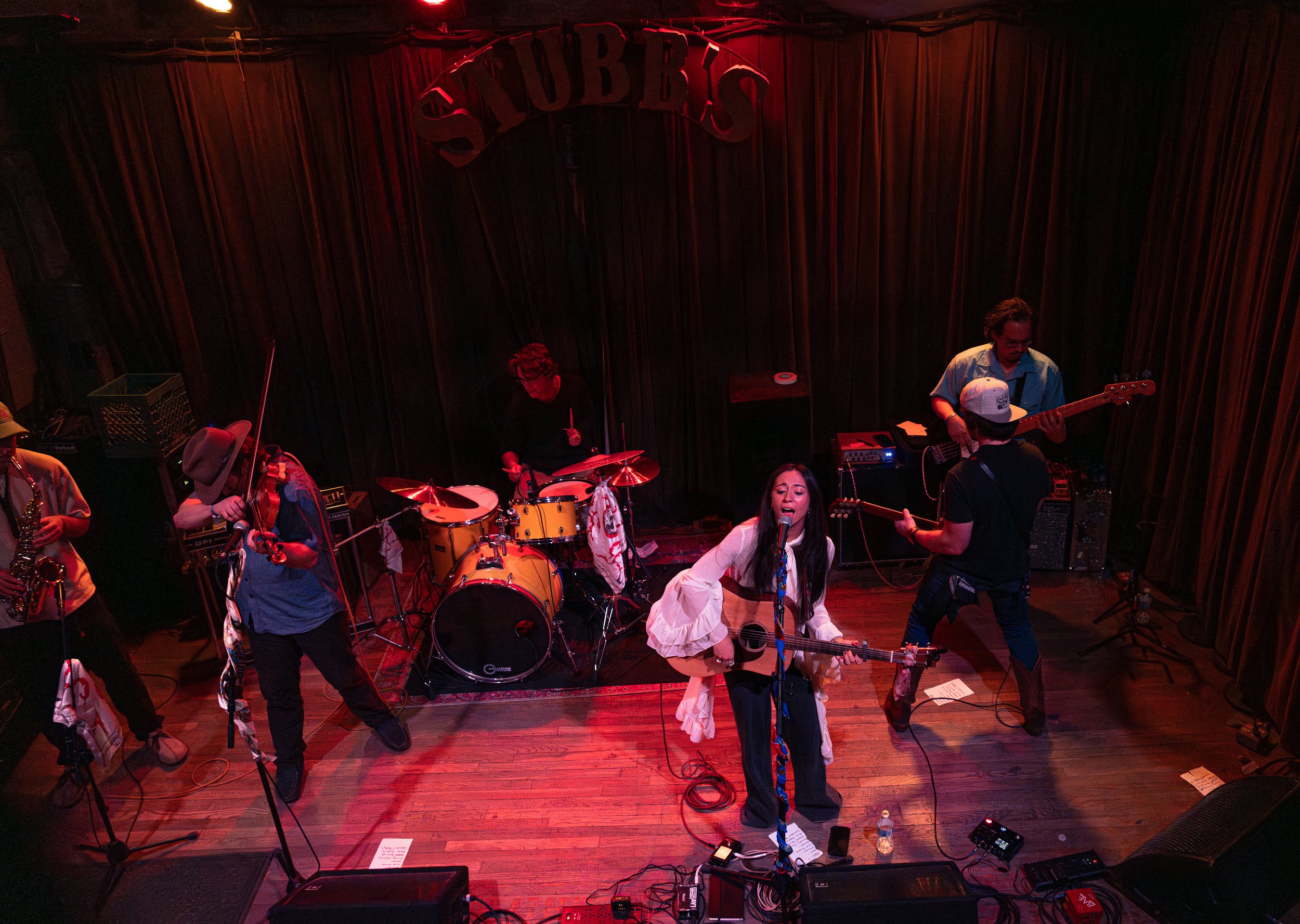  Kohanna and her band perform her last song of the night, “Colorado,” chanting the lyrics: “Pick me up / Where we going / Colorado.” 