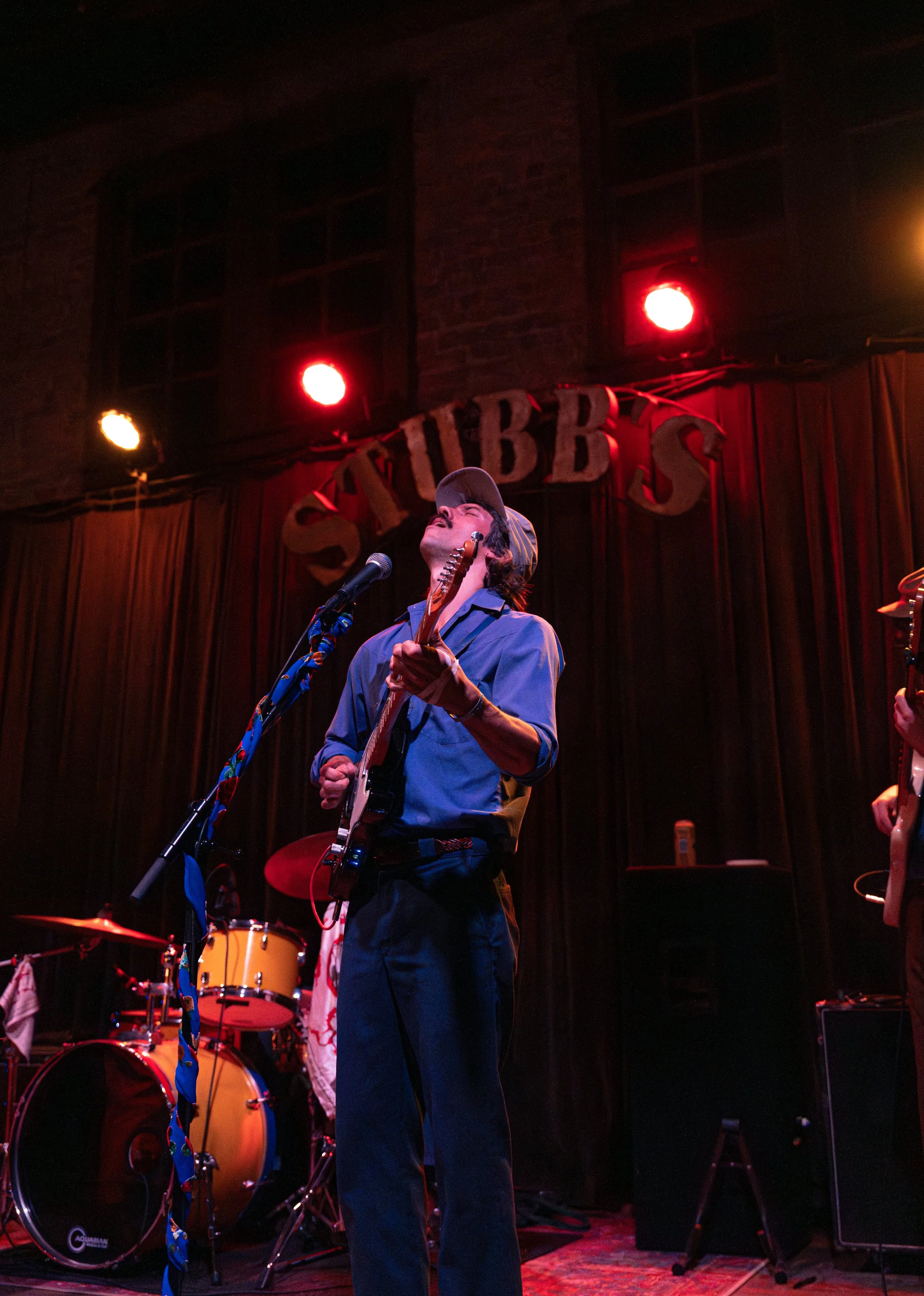  Tuskola leans back while singing about spring and cigarette burns during the grounding melody of “Cartoon Violence.” 