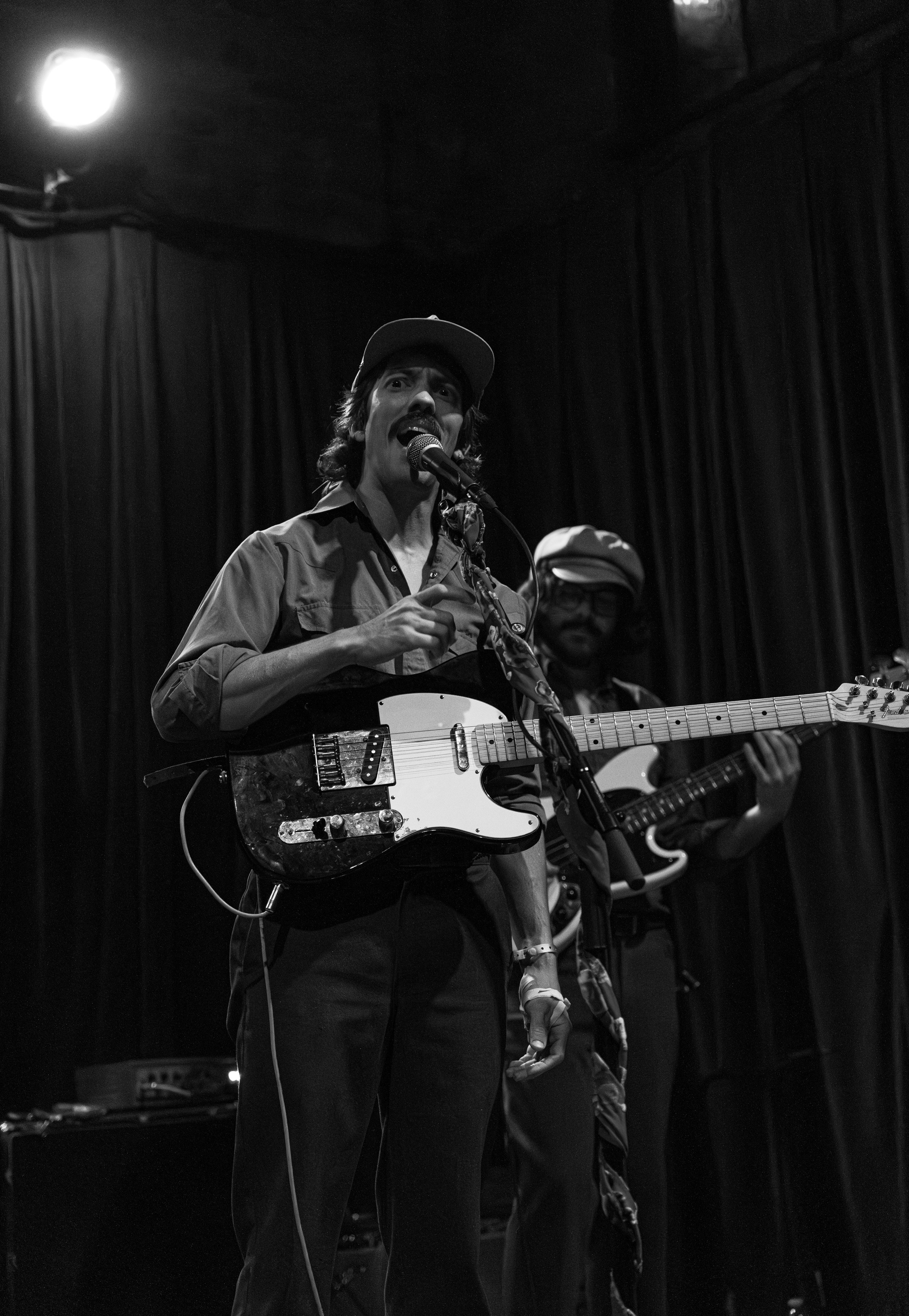  Tuskola fills the room with twangy guitar notes as he passionately sings the lyrics of “Thunderbolts”: “It starts in the dark / Who cares about these stars / Breath of the breeze is the backdrop for a breaking heart.” 