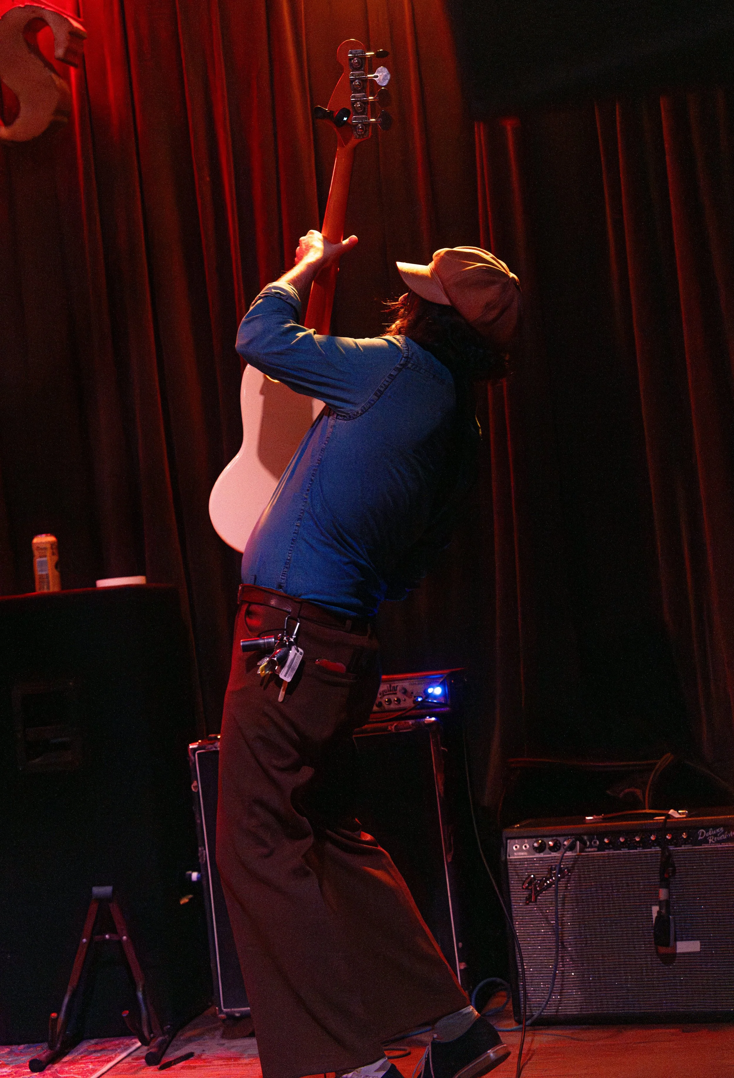  Guitarist Ryan Huseman holds up his guitar during the chorus of “Thunderbolts.” 