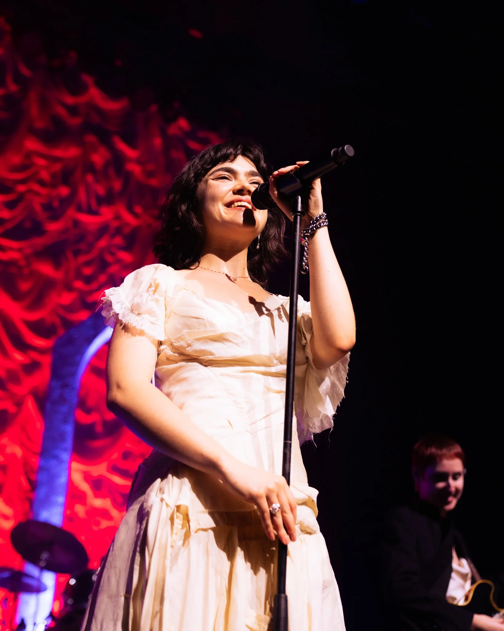  Lead vocalist Abigail Morris smiles into the crowd between “Count The Ways” and "Feminine Urge.” 