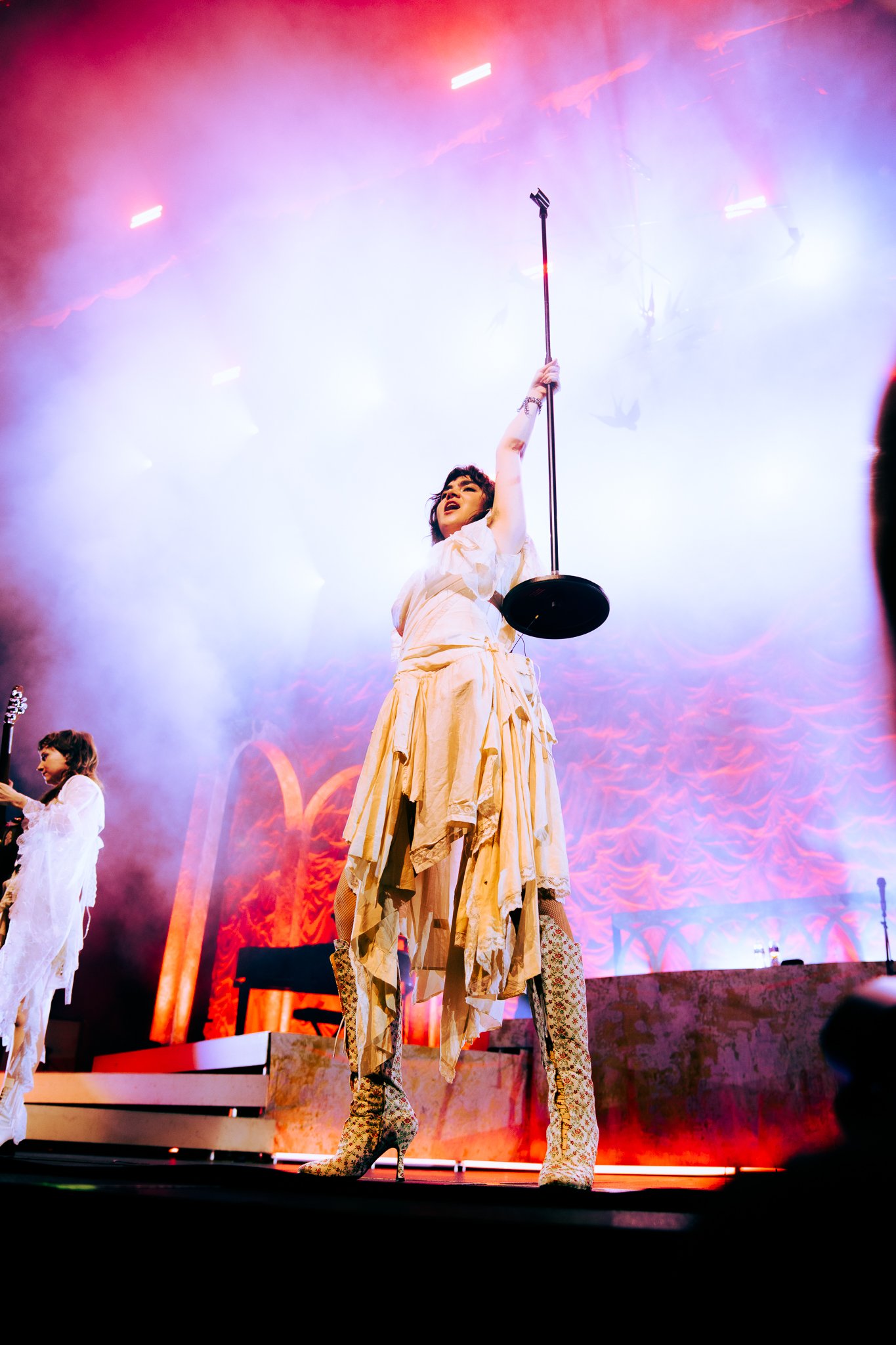  Morris holds up her mic stand as “The Feminine Urge” comes to an end. 