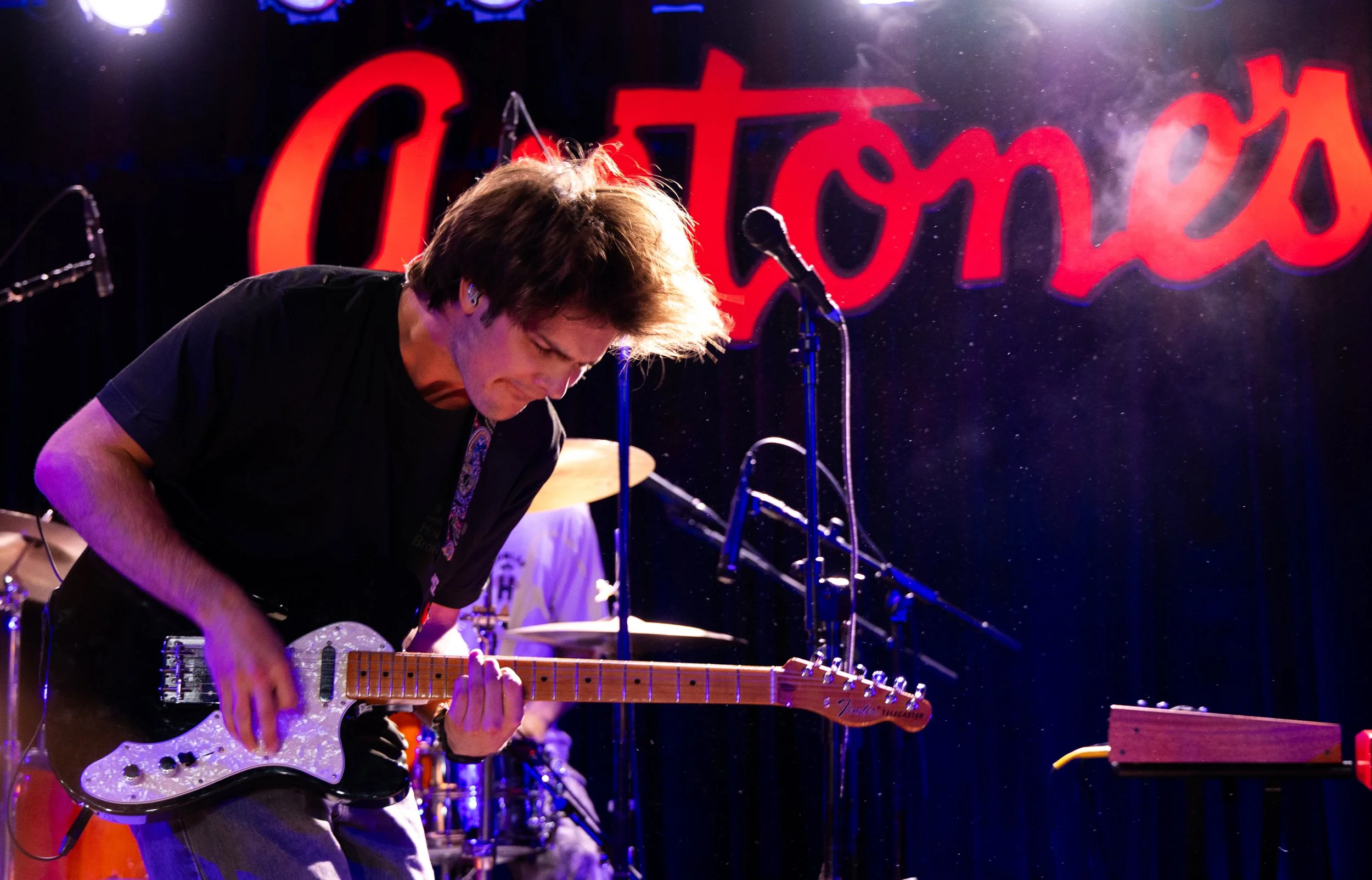  Lead singer of WinyahThomas Rowland shreds his guitar as the band performs the song "Feel It All Again" from the group's debut album  Lot to Learn.  