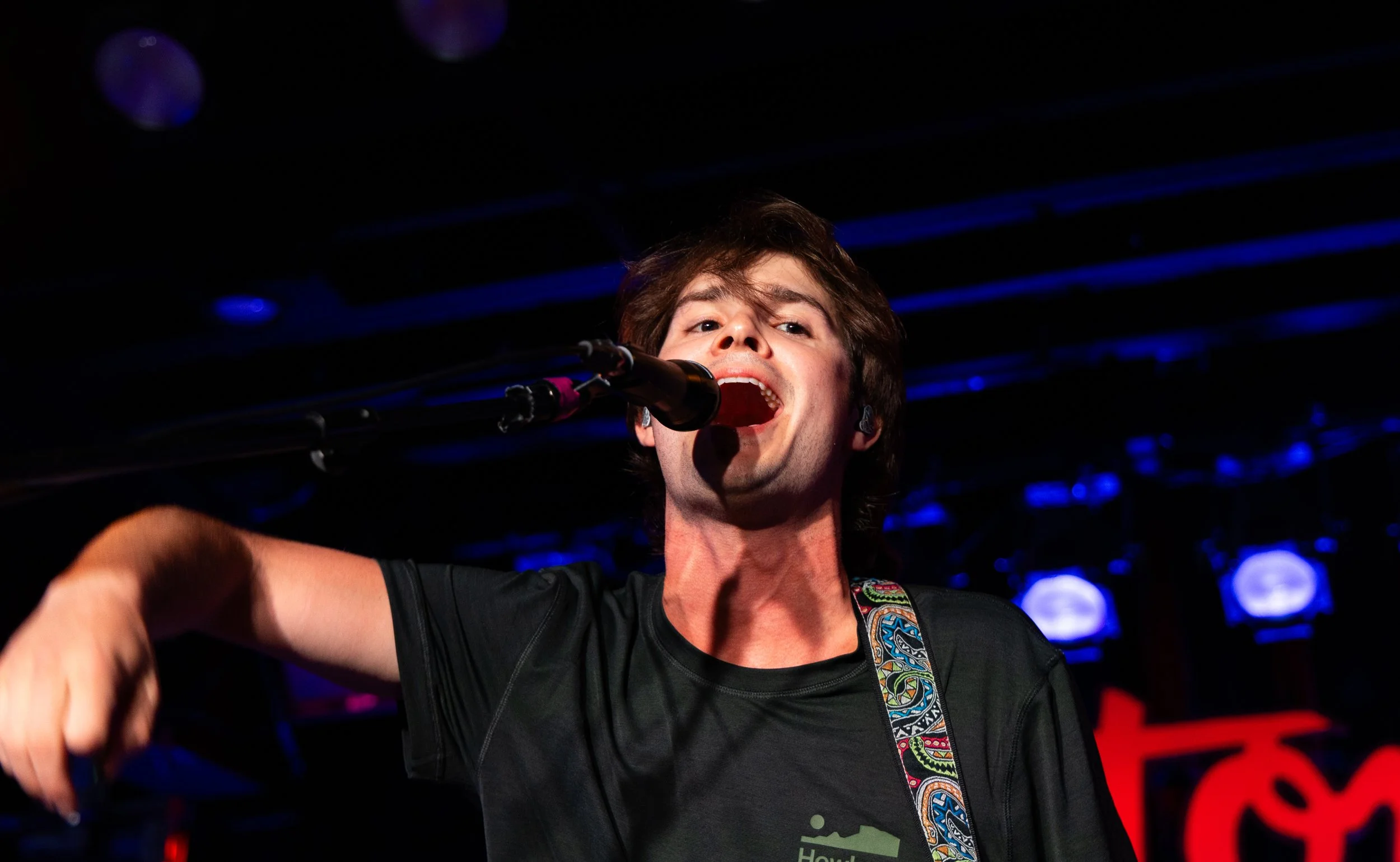  8-9. Rowland jumps around the stage as he plays the chords to "XO." 