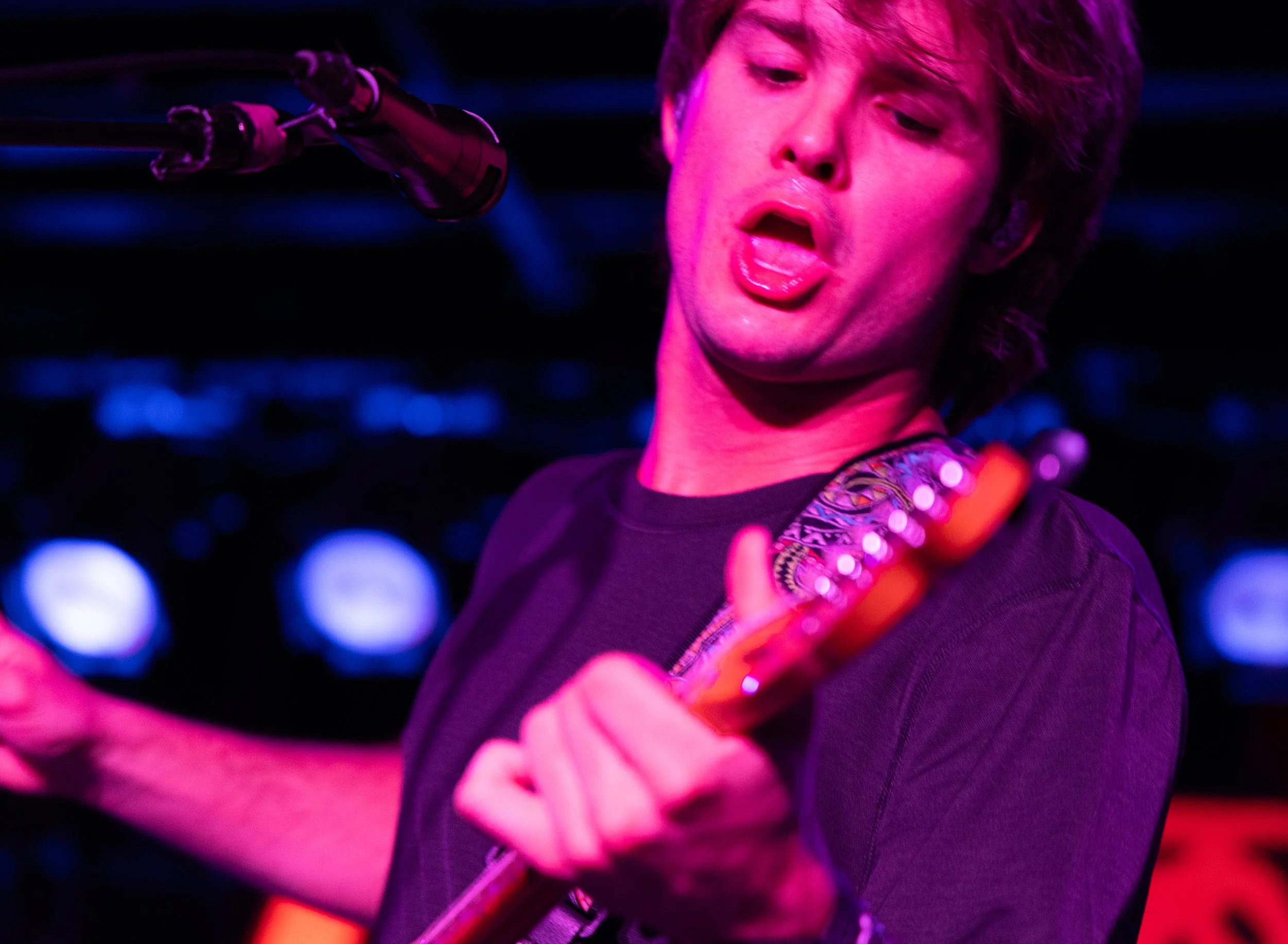  8-9. Rowland jumps around the stage as he plays the chords to "XO." 