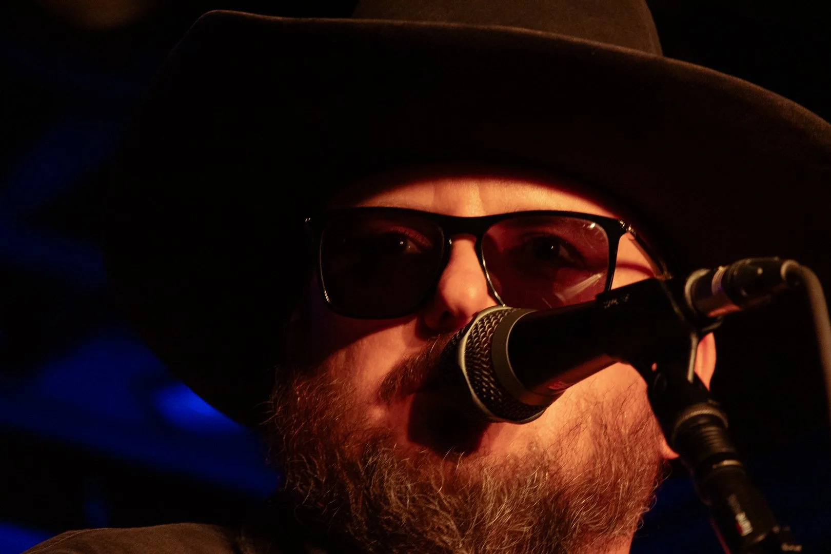  Paul Cauthen talks to the audience about his grandfather and his inspiration for music before performing his first song. 