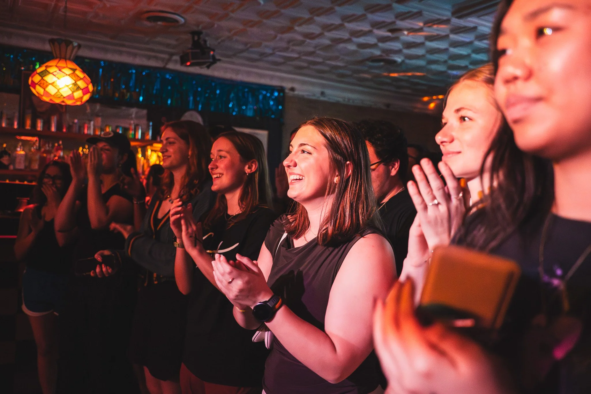  Audience members applaud Grits after they close their set with the song “Mercury" from their 2025 album  Leatherbound.  