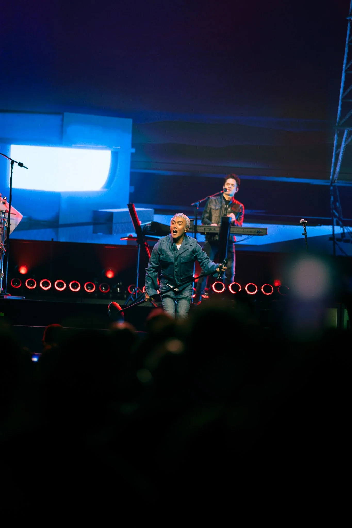  Arnel Pineda, lead singer since 2007, belts on stage as the band performs music released over 40 years ago. 