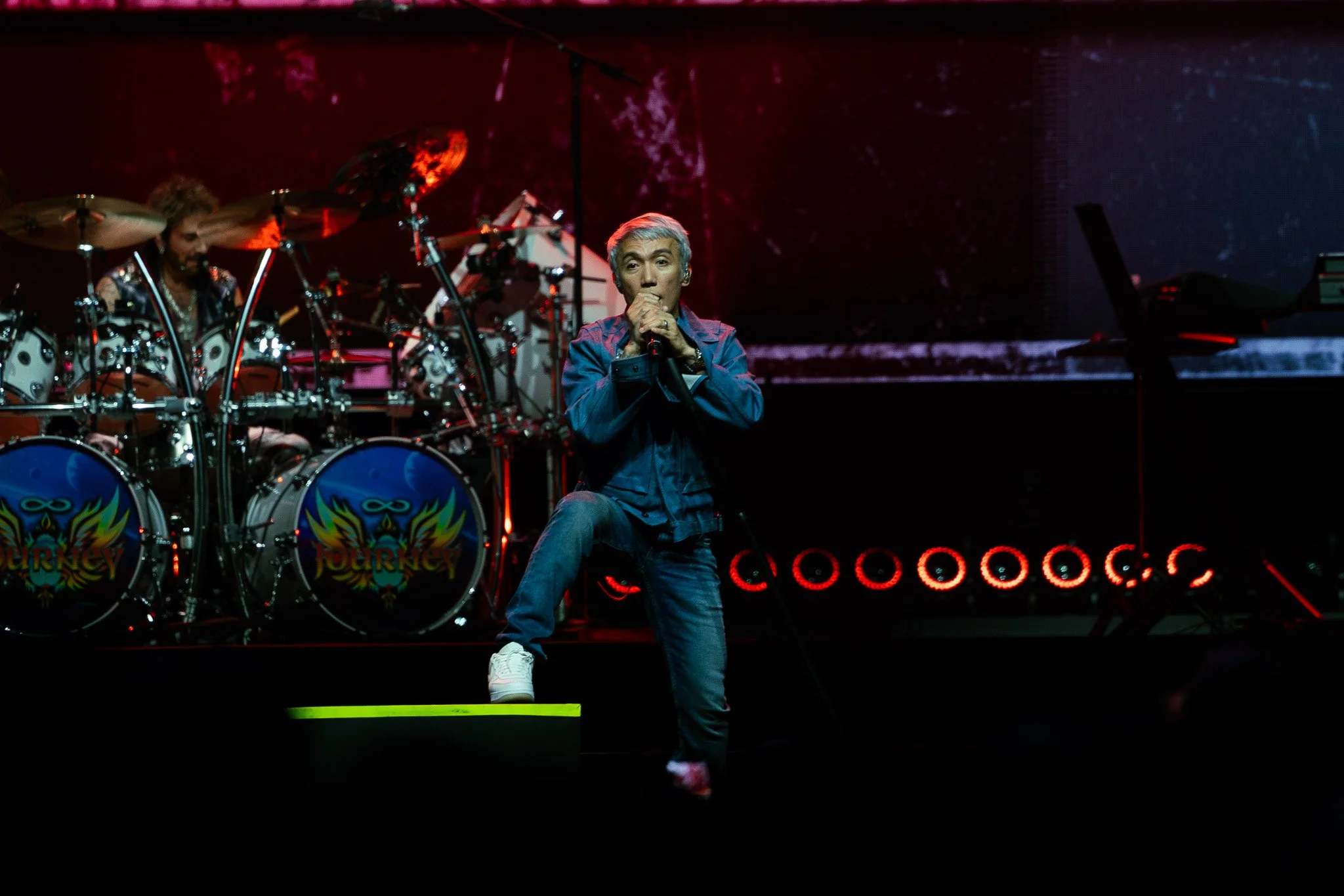 Arnel Pineda, lead singer since 2007, belts on stage as the band performs music released over 40 years ago. 