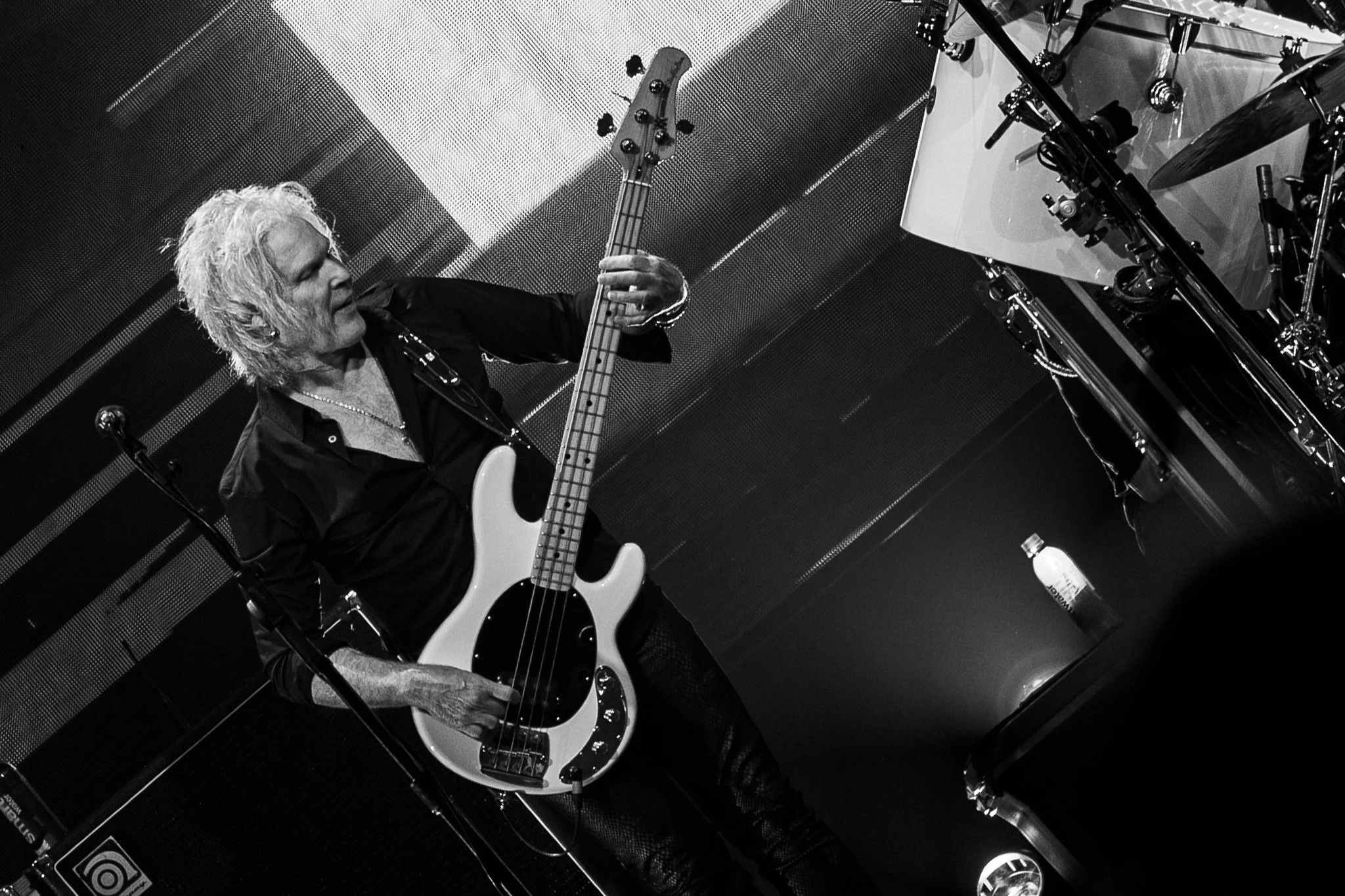  Bassist Todd Jensen keeps the band's rhythm during a performance of “Stone in Love” from the 1981 album  Escape . 