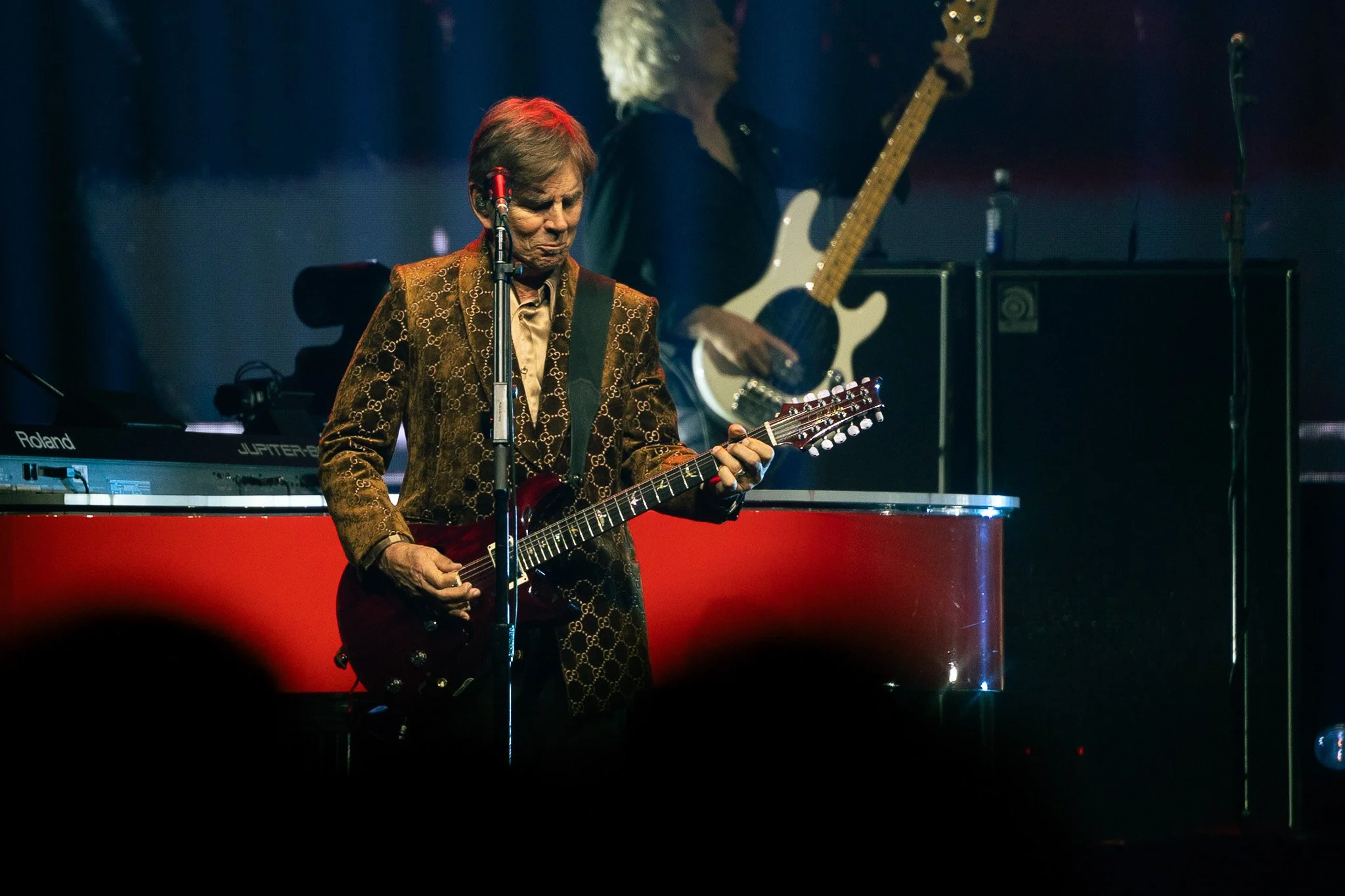  Cain steps away from the keyboard to play rhythm guitar during the band’s performance of “Ask the Lonely.” 