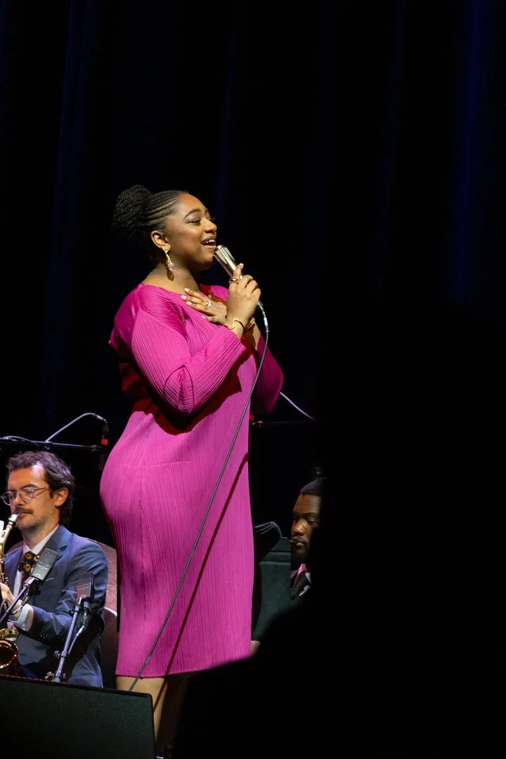  Joy walks around the stage while singing the bouncy “Peace of Mind/Dreams Come True.” 