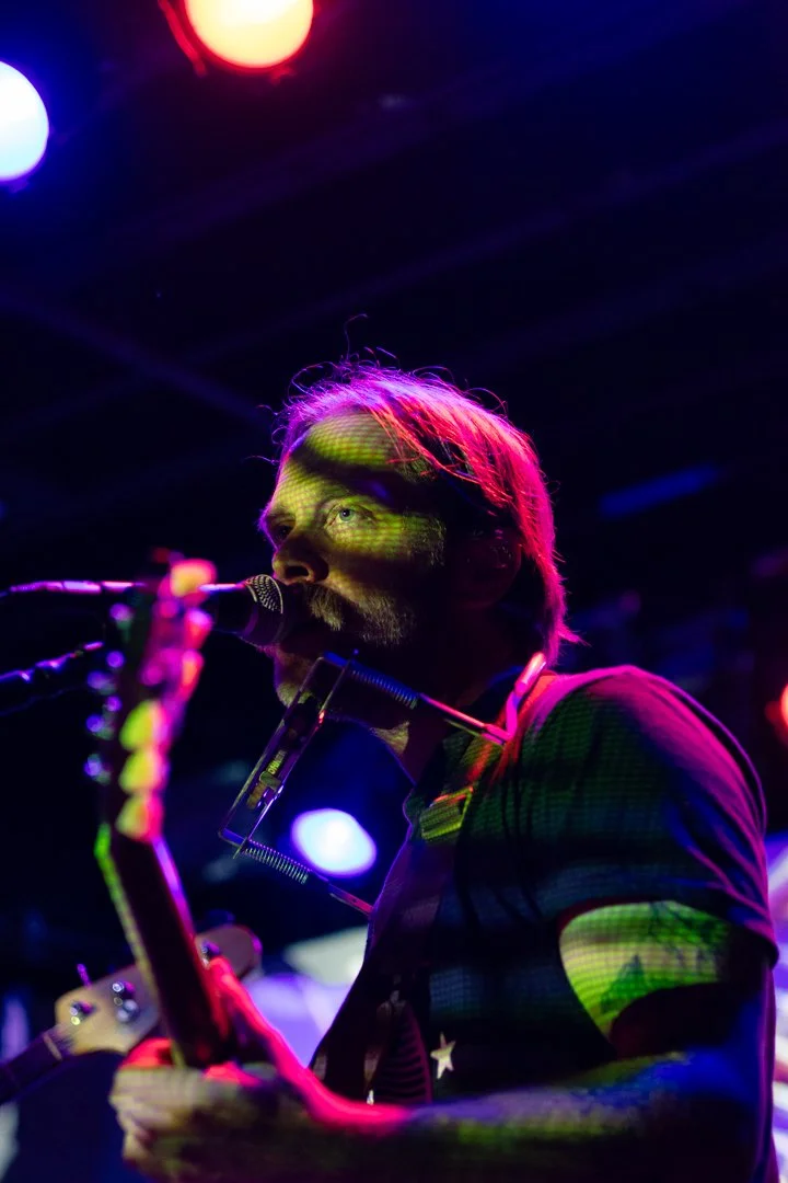  Price sings the lively guitar country song “In Between” with a harmonica around his neck.&nbsp; 