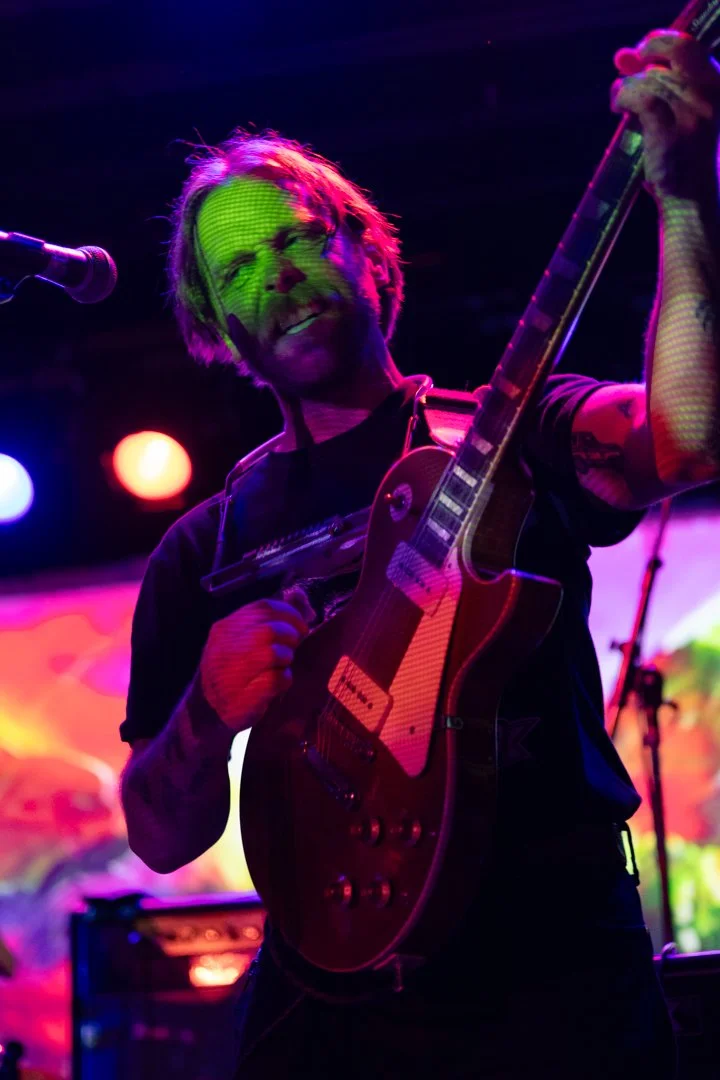  Price rocks out to the heavy guitar song “How it Feels.” 