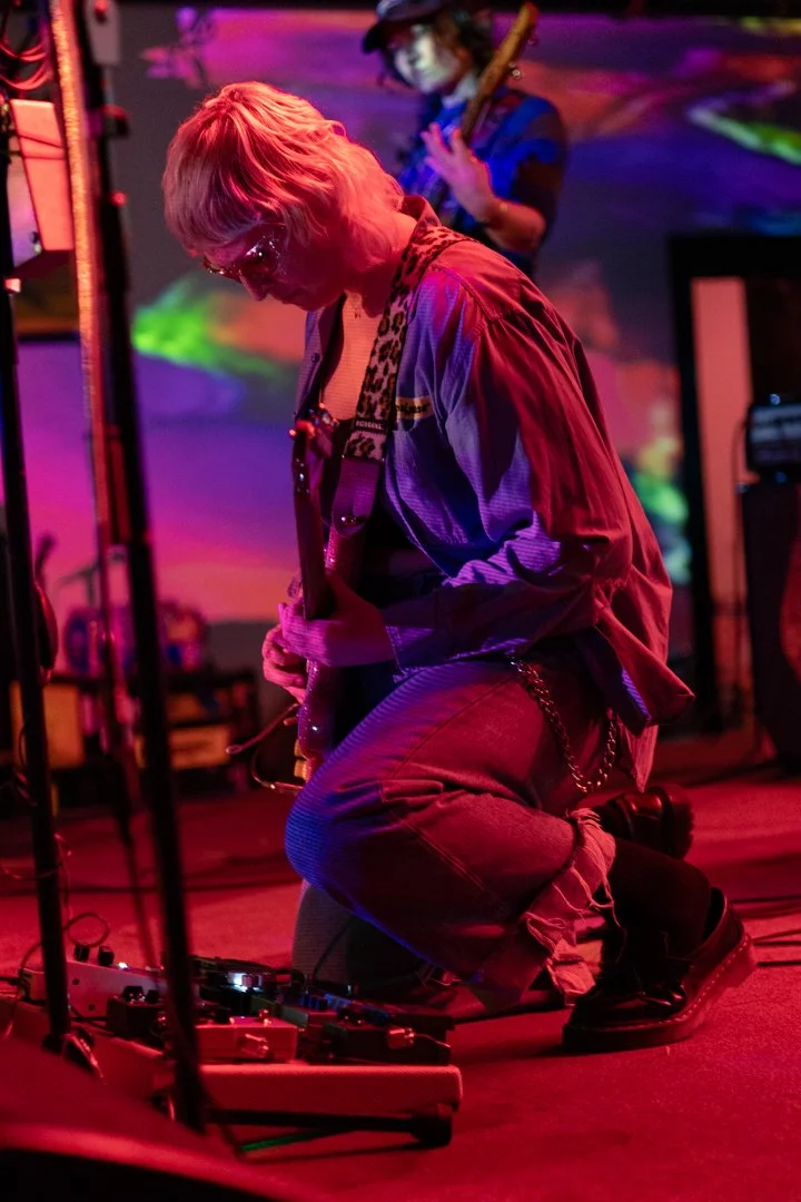  Cooper looks at the effects pedal during “Changes.” 