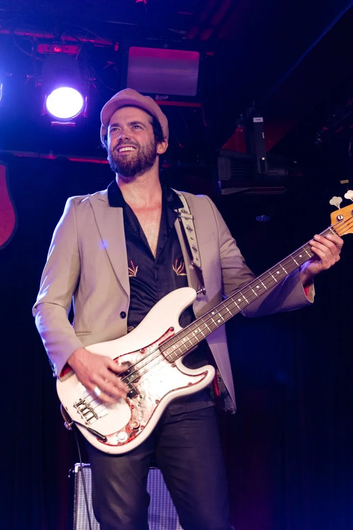  Guitarist Matthew Wilson smiles while playing “Long Is The Road.” 