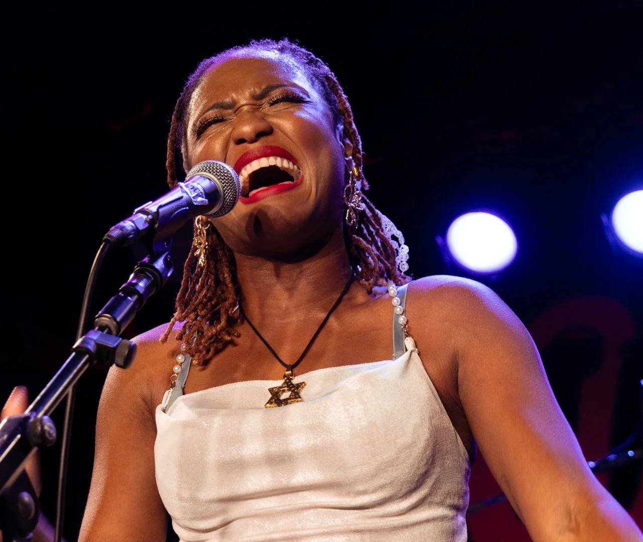  Tierinii Jackson belts to high notes in “Long Is The Road.” 