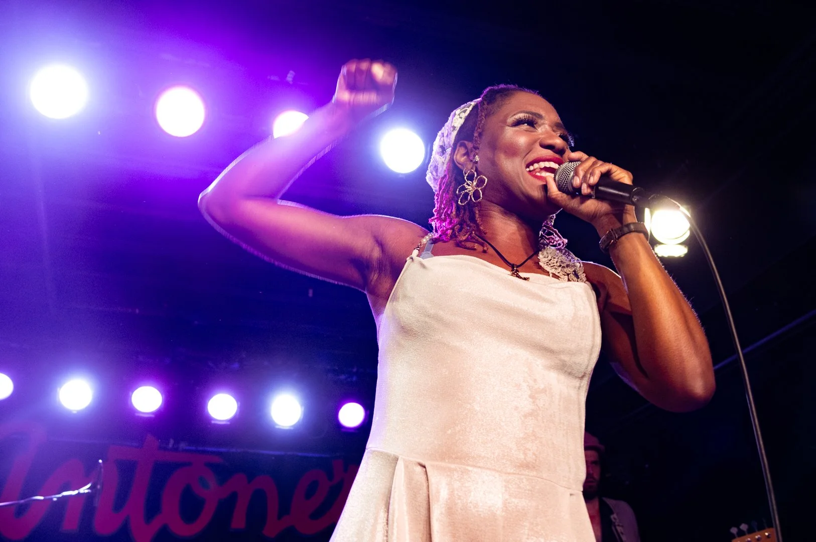  Tierinii Jackson pumps her fist to upbeat “Back To What Feels Right” to the audience. 
