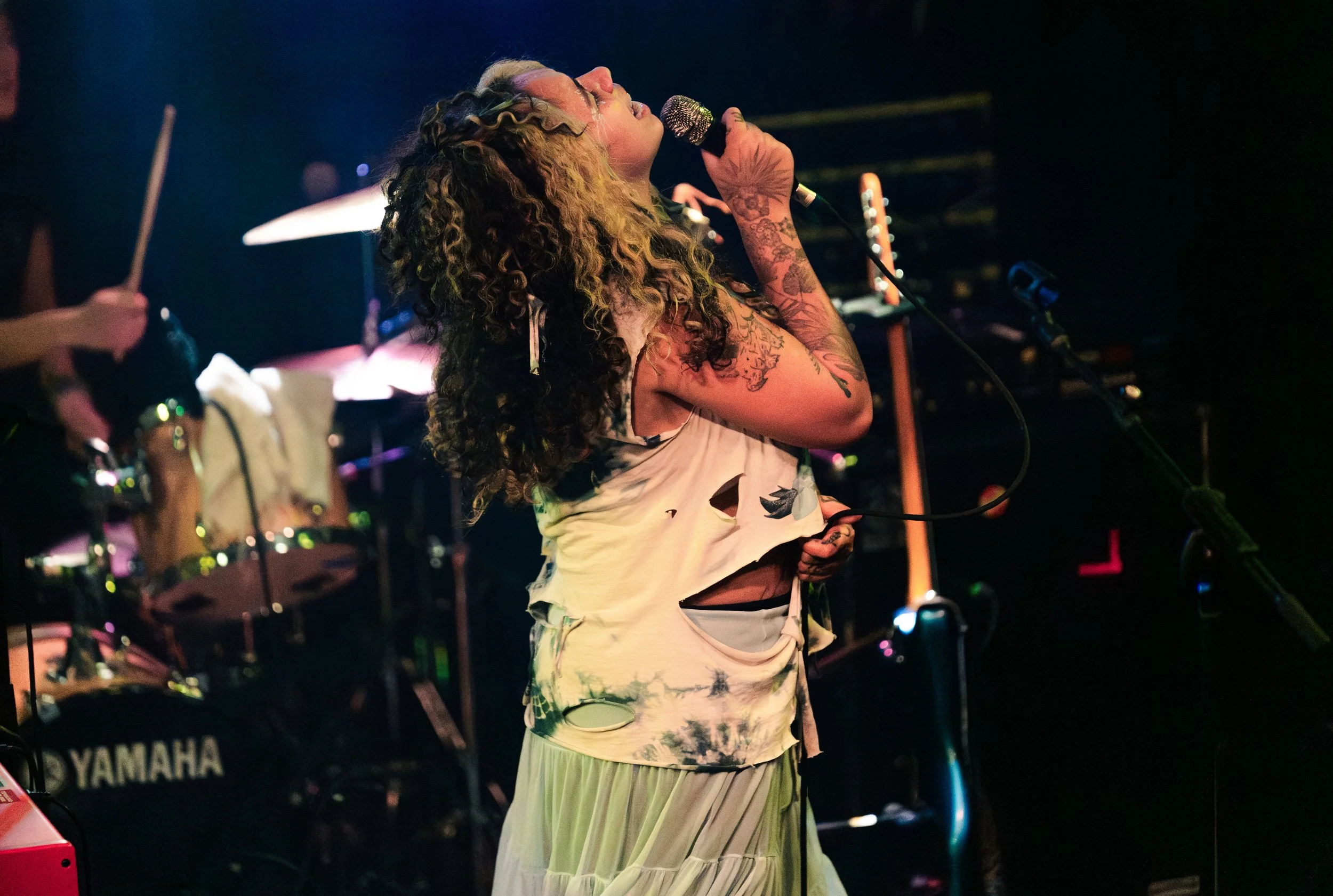  Souza looks up to the sky as she sings “Crying Over Nothing” from her latest album  Precipice.  