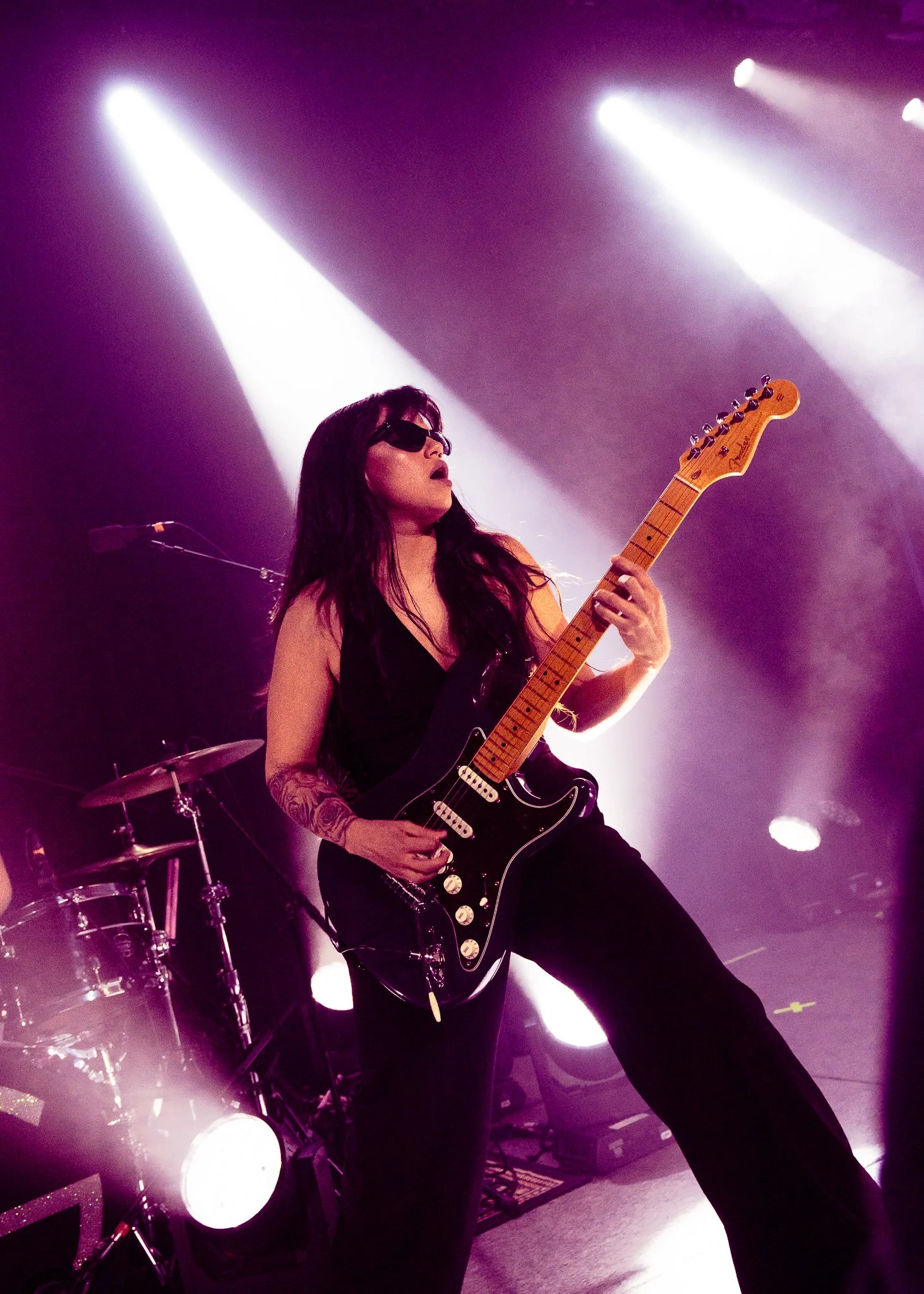  Guitarist and bassist Cindë fervently plays the guitar during “The Angel And The Saint.” 