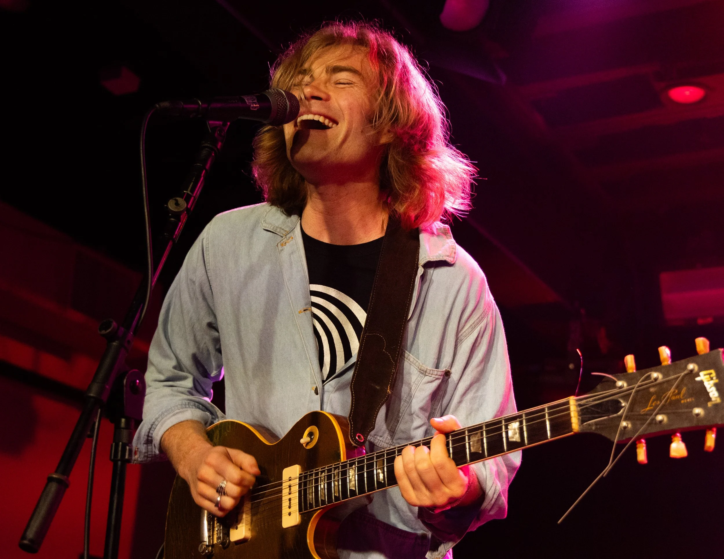  Jack Bradley, guitarist for The Thing, smiles while he sings backup vocals to “Do The Right Thing.” 