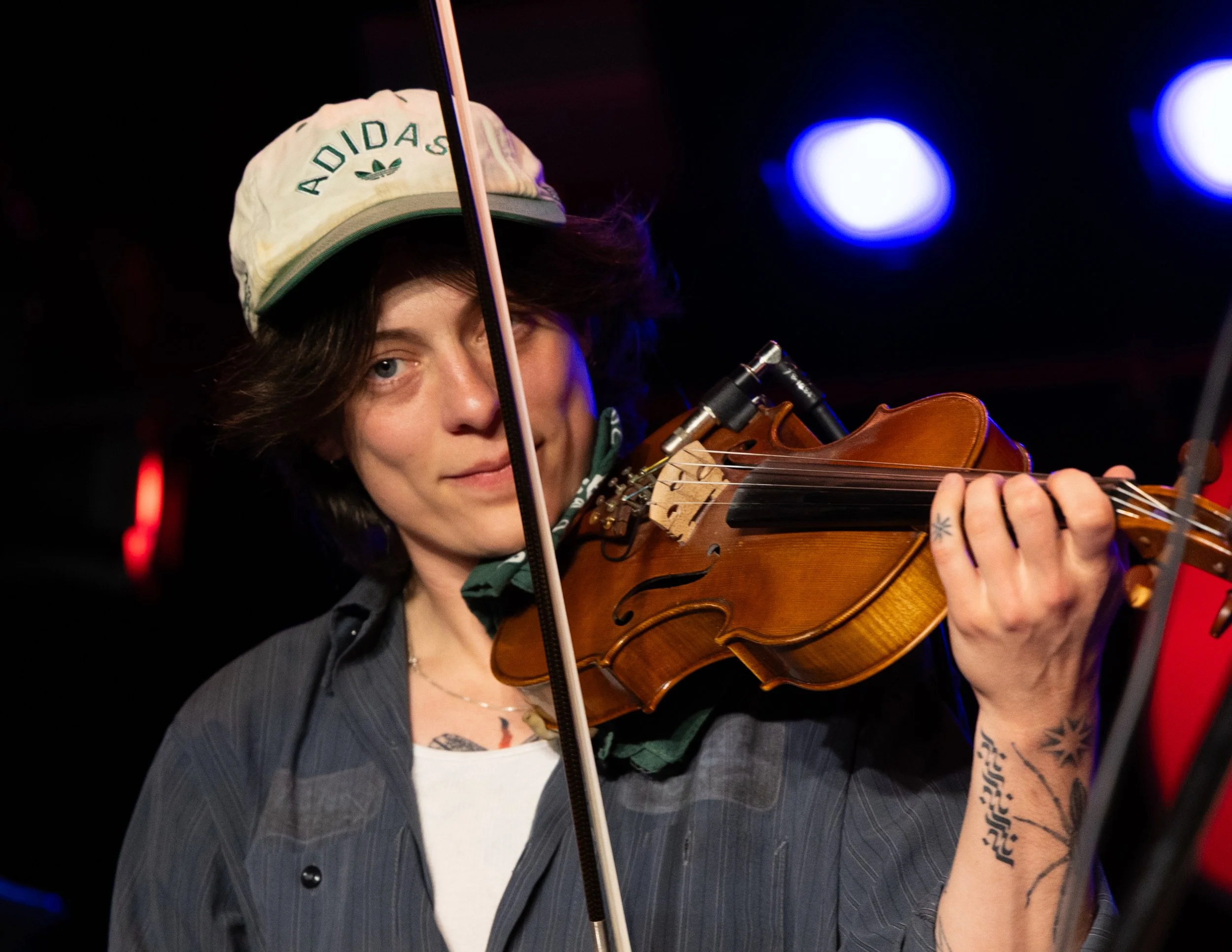  Zoe Eshan, violinist for Tombstone Poetry, plays the rich strings to the unreleased song “Hell Tribune” to open up the night. 