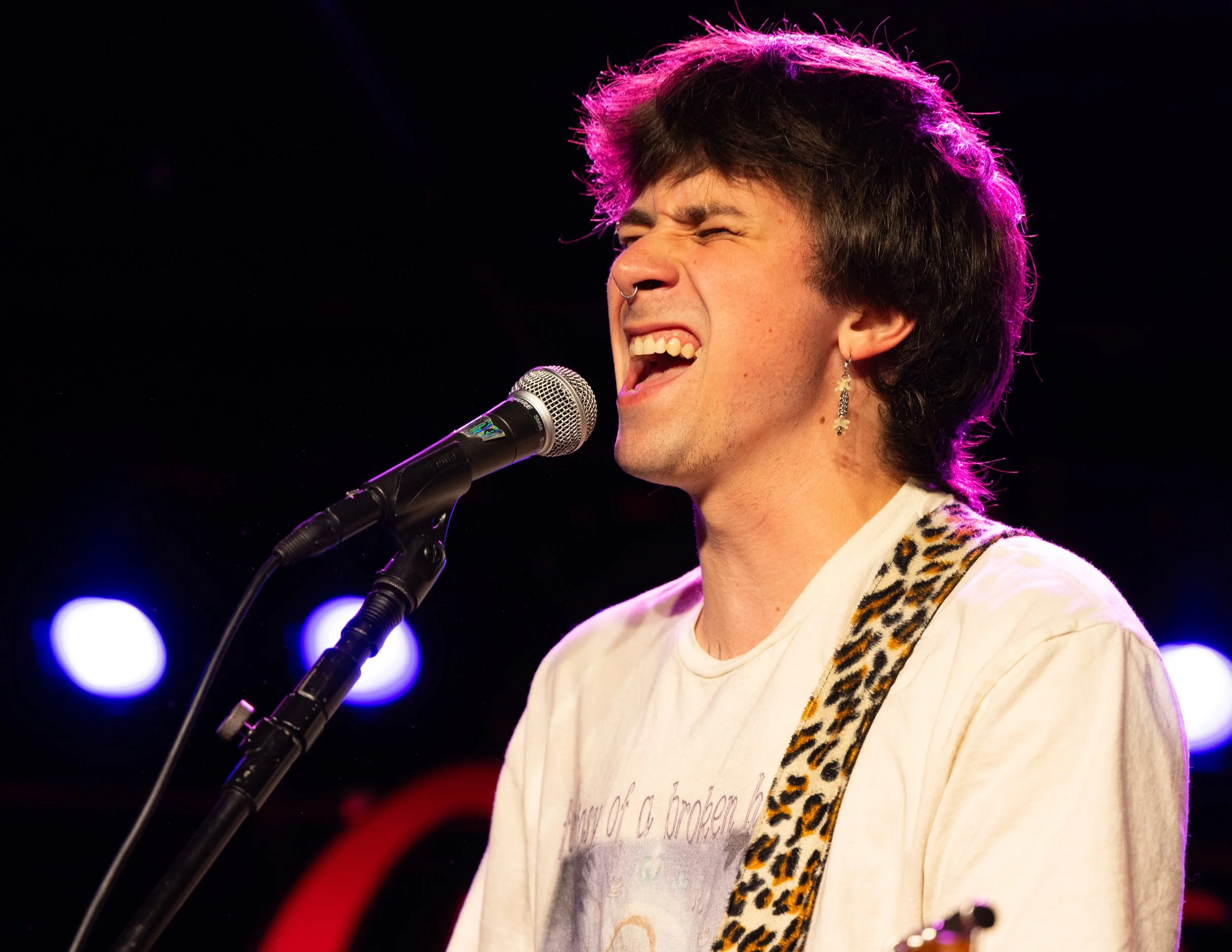  Vocalist Caelan Burris passionately sings “Hell Tribune.” 