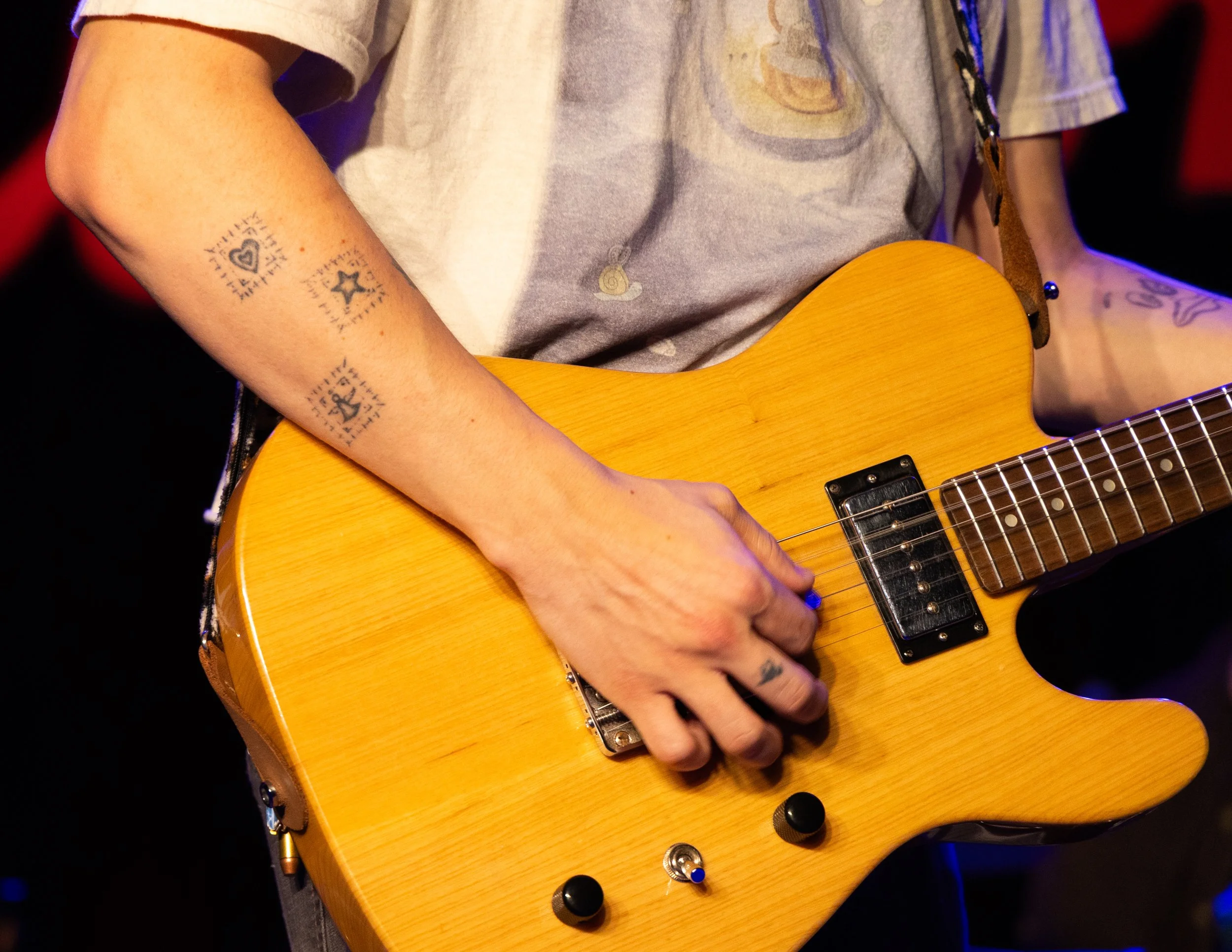  Burris strums the chords to the smooth, country influenced melody of “The Lord” from the band’s debut album  How Could I Be So In Debt?  