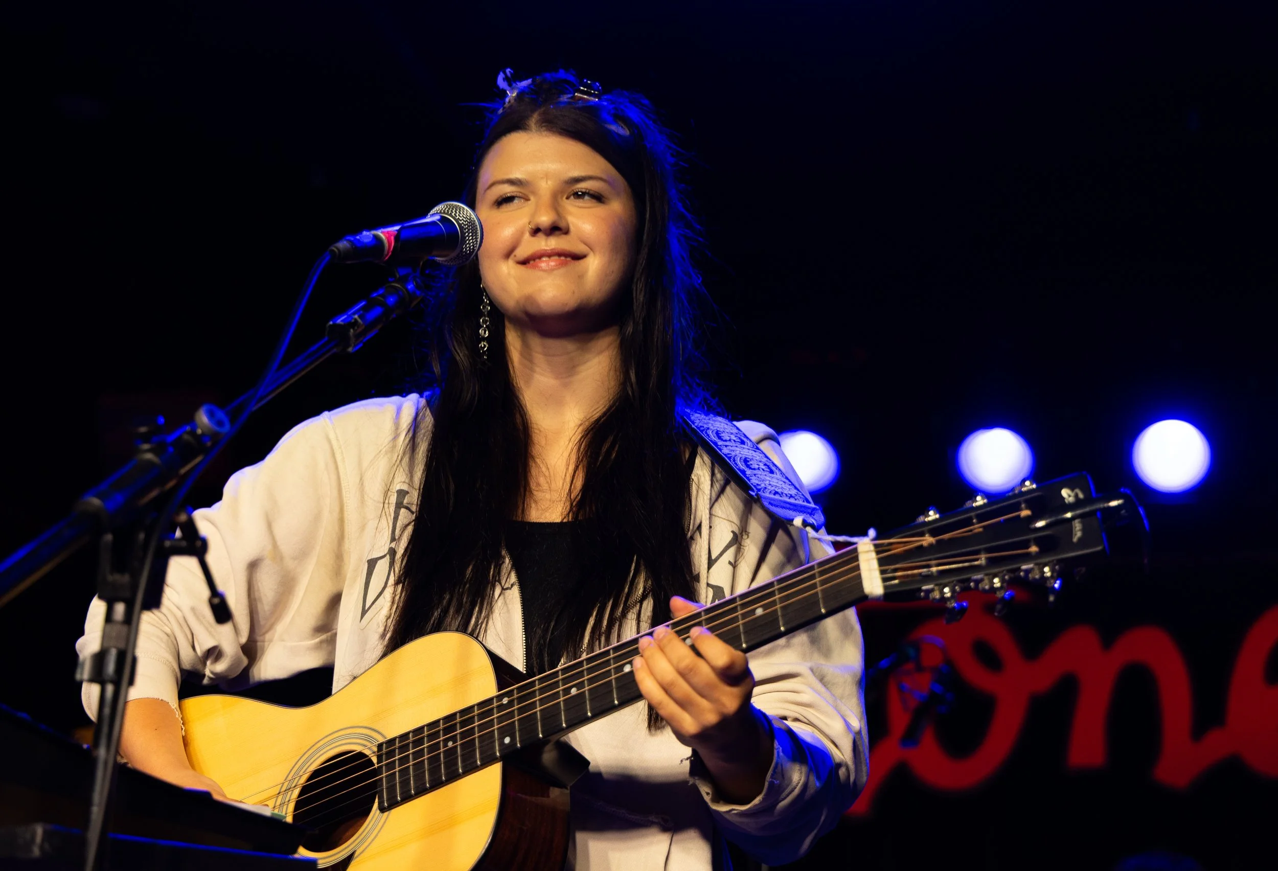  Eliza McLamb smiles at the audience before opening her set with “Better Song” from her latest album  Good Story . 