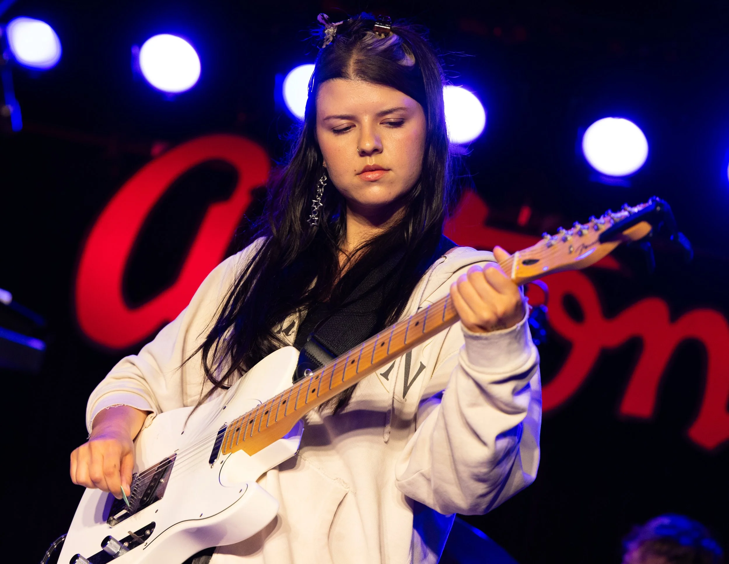  McLamb feels the music as she strums the chords to “Better Song.” 