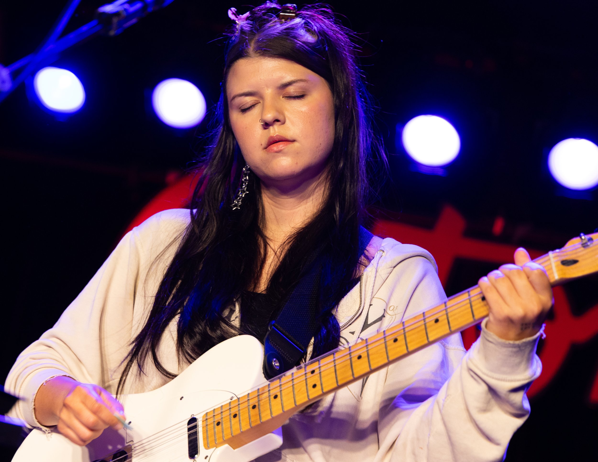  McLamb feels the music as she strums the chords to “Better Song.” 
