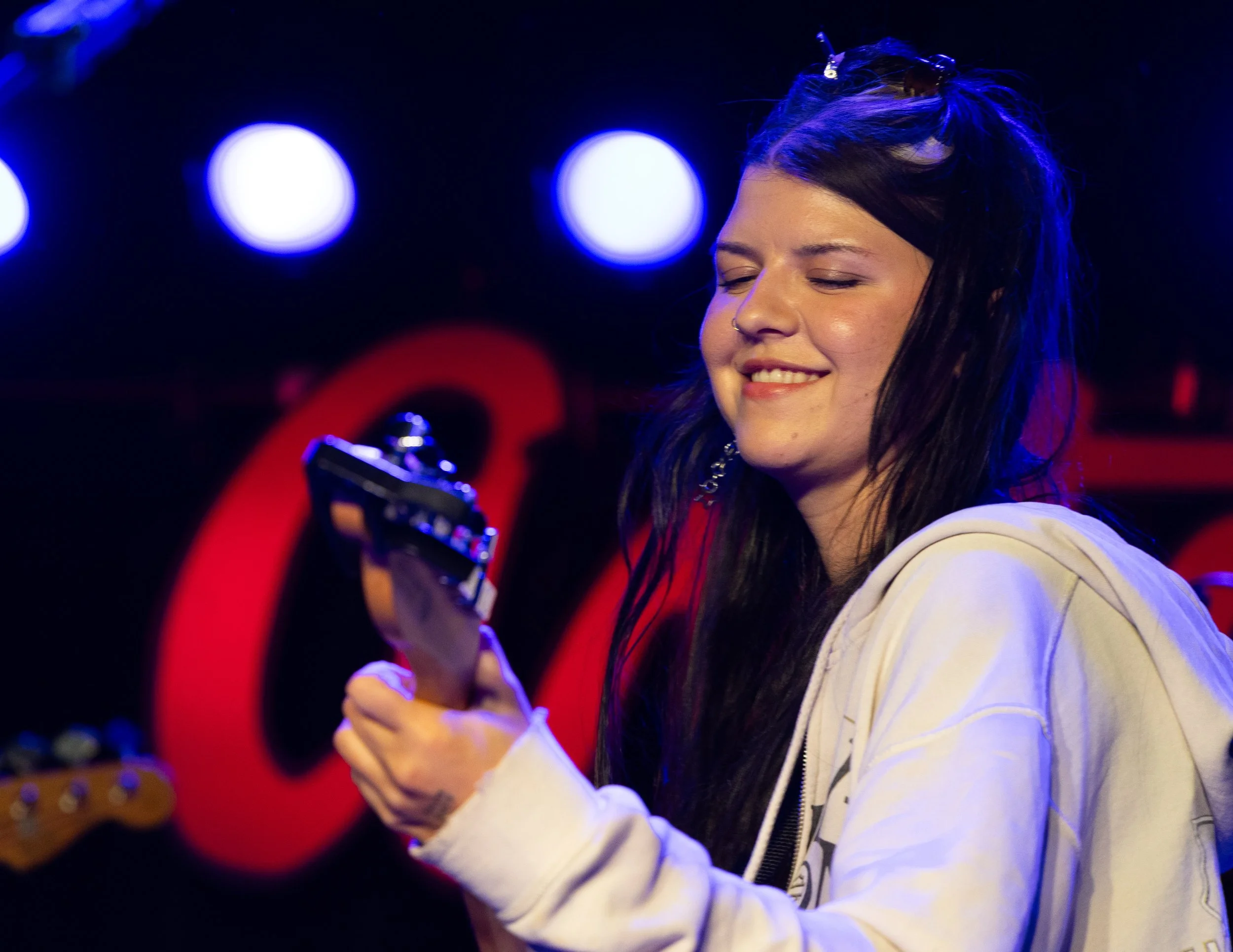  McLamb feels the music as she strums the chords to “Better Song.” 