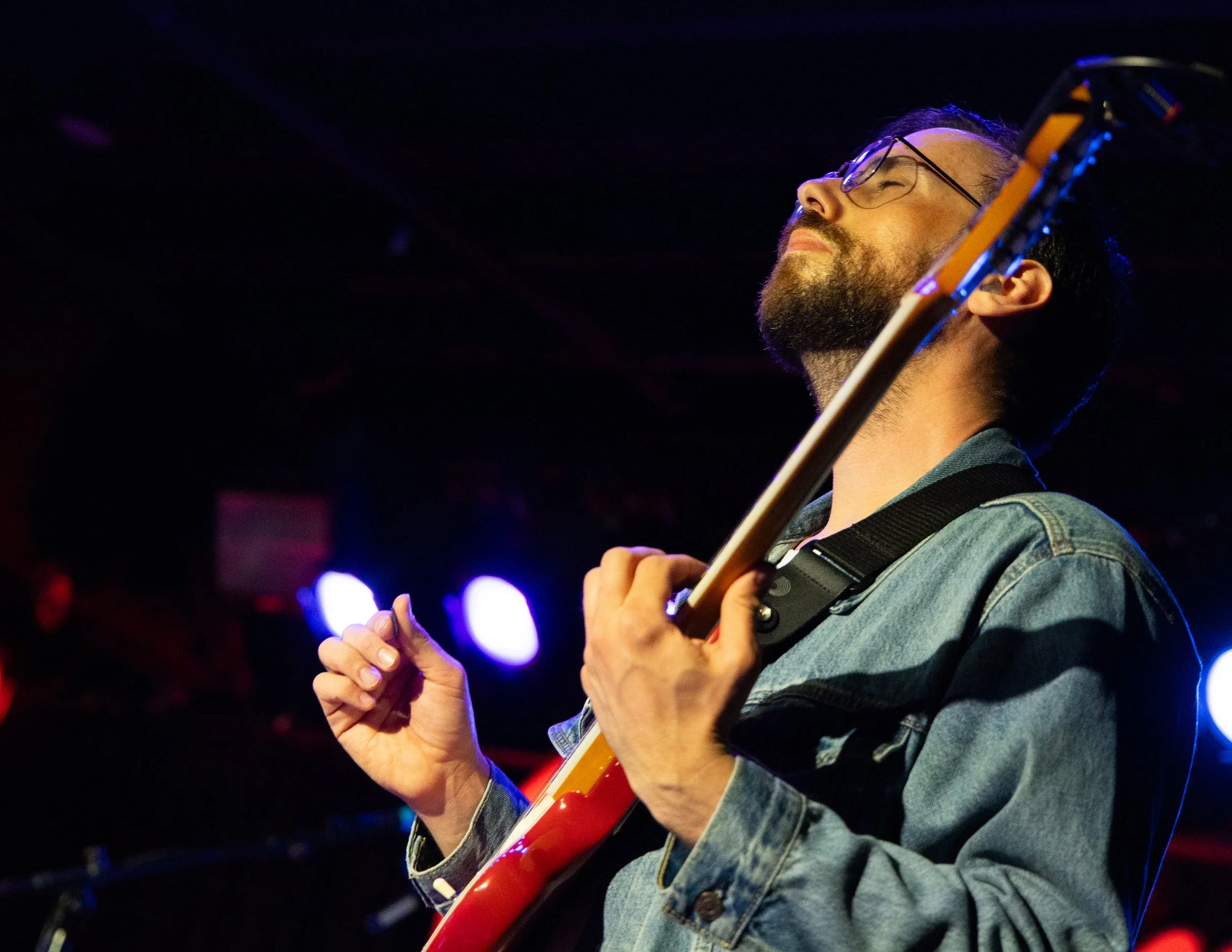  Guitarist Jacob Blizard is immersed in the music while playing the chords to the growing up song “Glitter” from McLamb’s debut studio album  Going Through It . 
